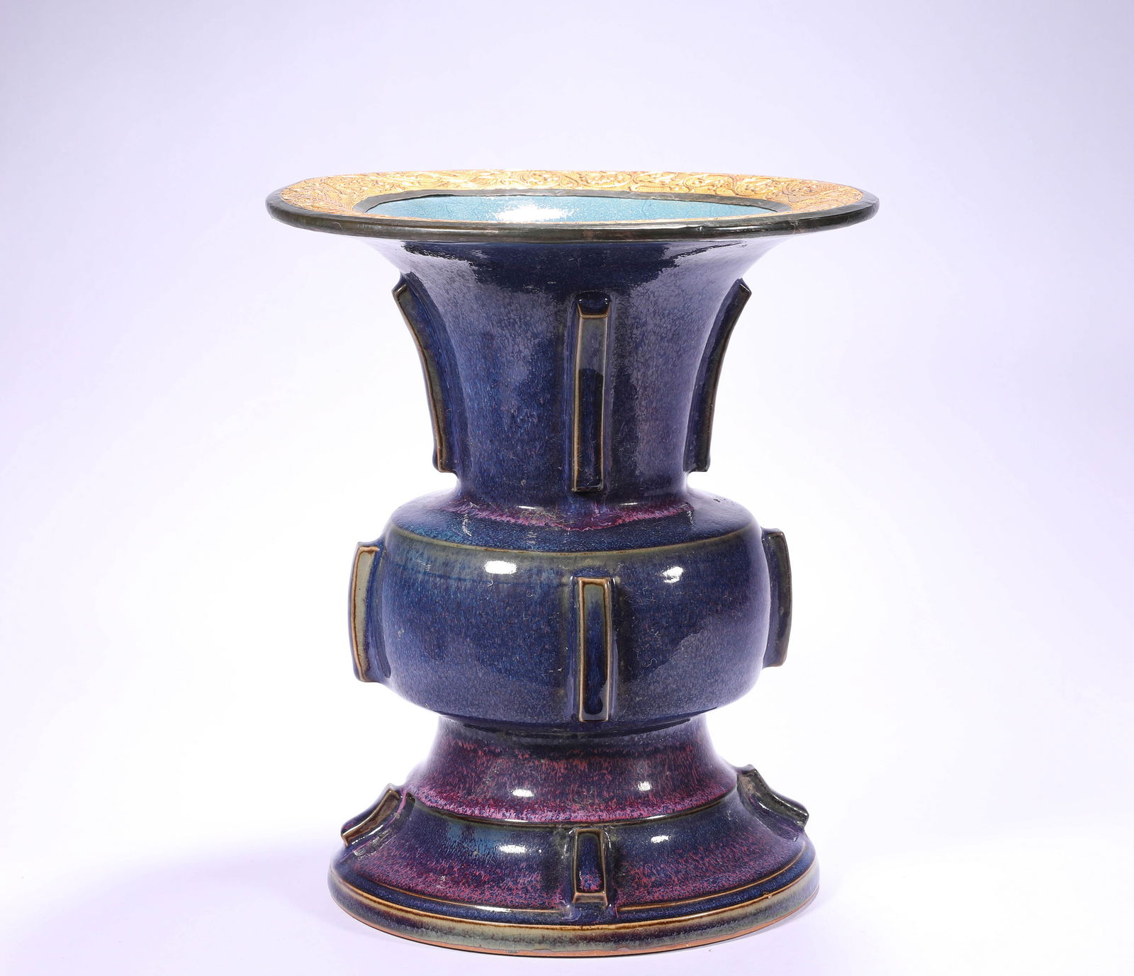 A ROSE-PURPLE GLAZED VASE FROM JUN KILN DURING THE NORTHERN SONG DYNASTY: H:26cmW:22.5cm This is a sky-blue glazed purple-spotted halberd-shaped vessel from the Jun Kiln of the Song Dynasty (with gold wrapped around the back of the rim), a typical shape of the Jun Kiln, one