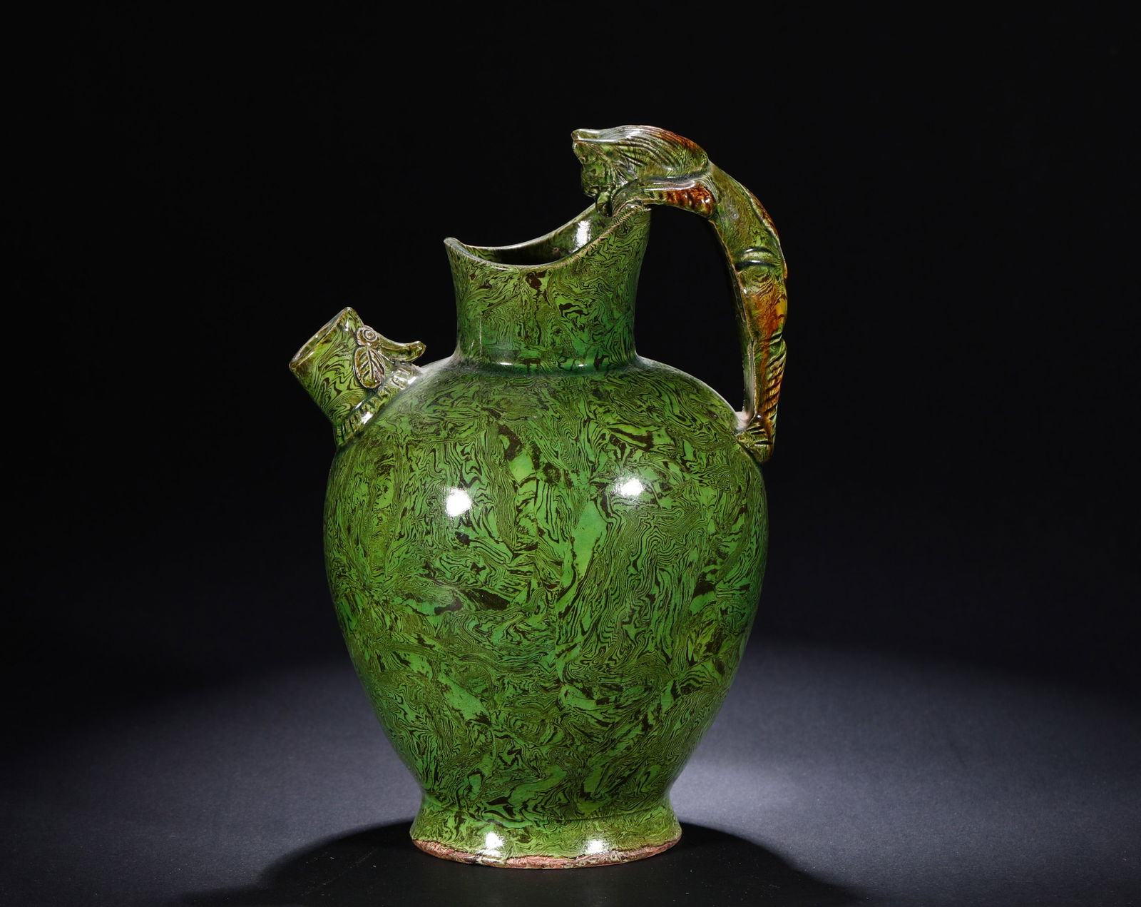 TANG DYNASTY, GREEN GLAZED TWISTED BODY EWER: H:21cmW:14cm