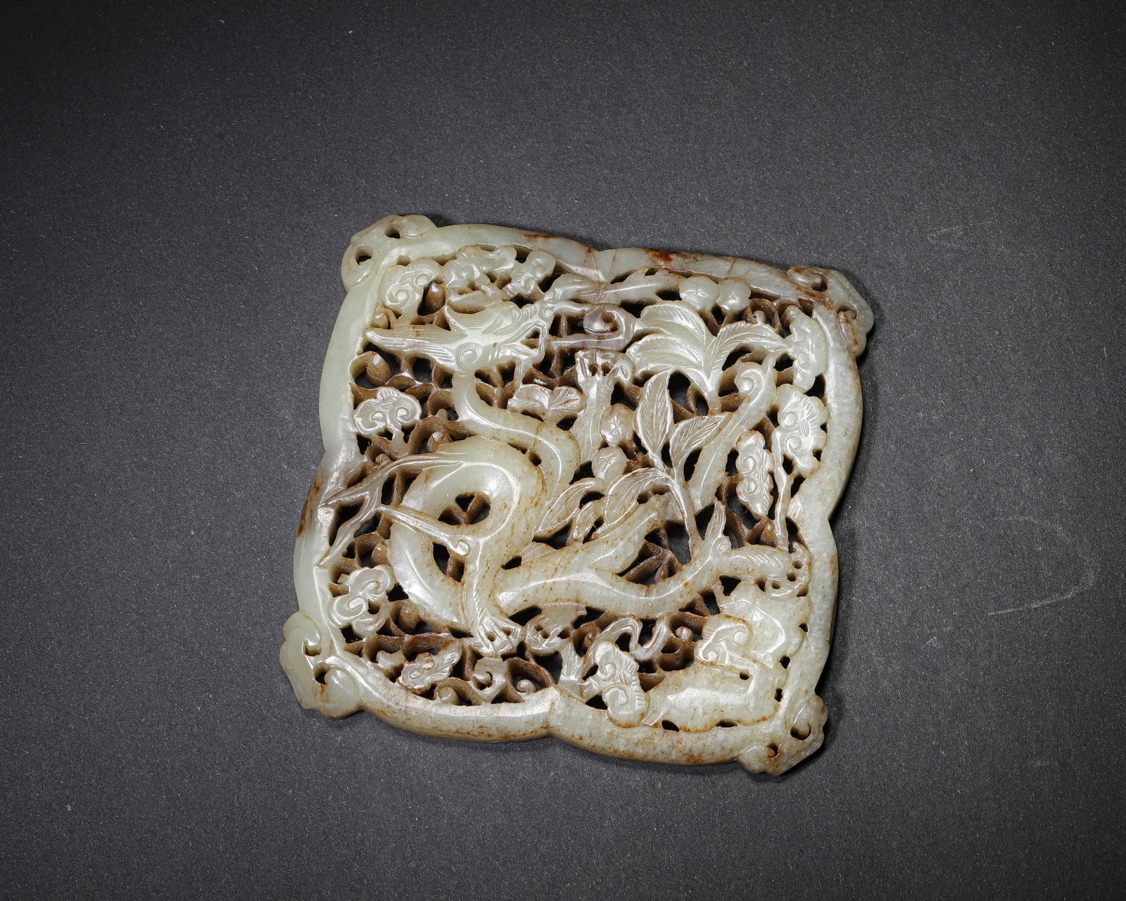 HETIAN JADE RETICULATED 'DRAGON AND LINGZHI' BELT PLAQUE, MID TO LATE MING DYNASTY (1 of 6)