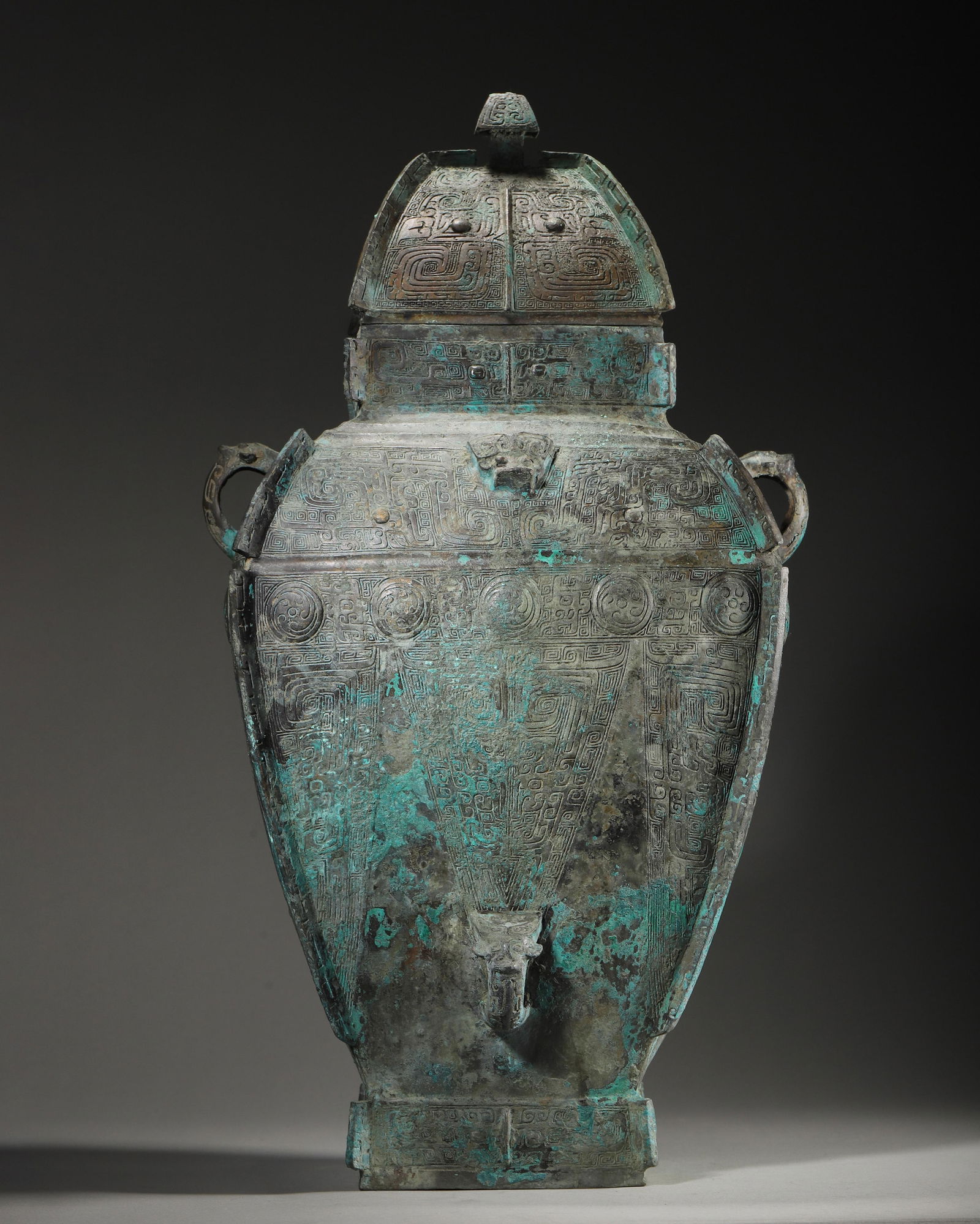 AN IMPORTANT ARCHAIC BRONZE SQUARE WINE VESSEL (LEI), LATE SHANG DYNASTY (1 of 11)
