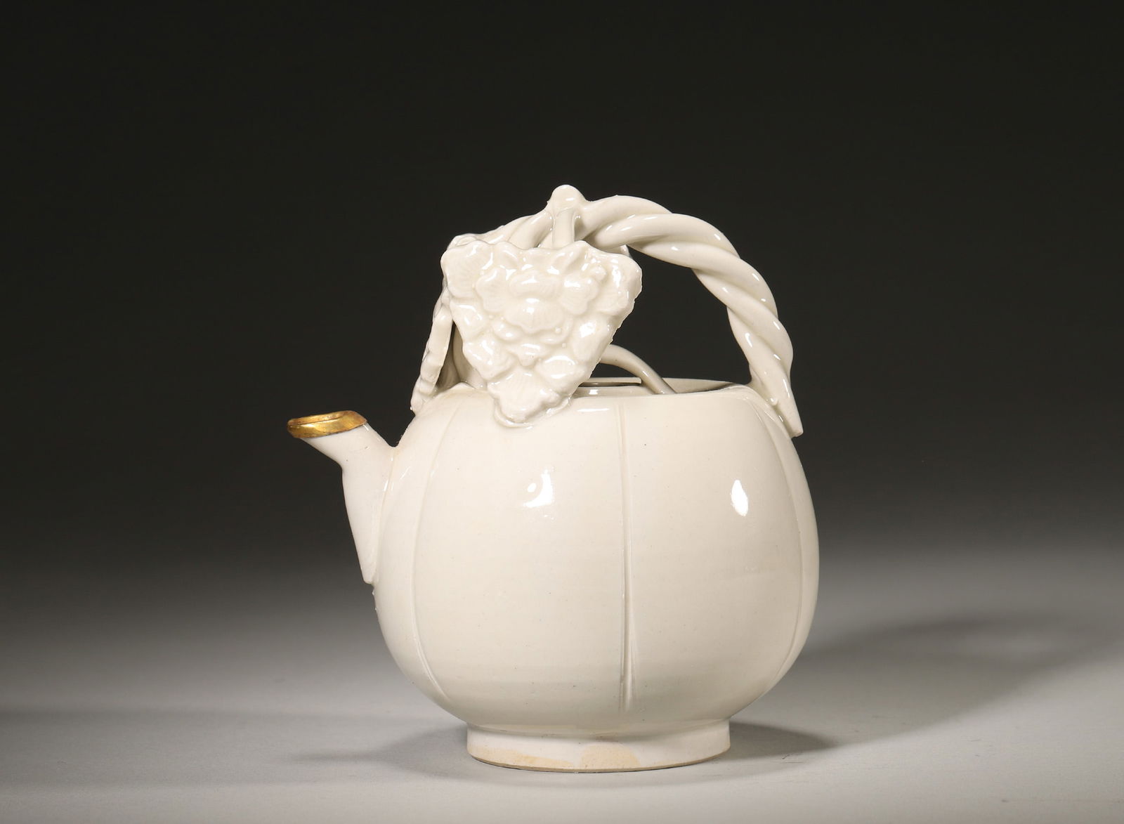 A NORTHERN SONG DYNASTY DINGYAO WHITE-GLAZED MELON-SHAPED EWER (1 of 5)