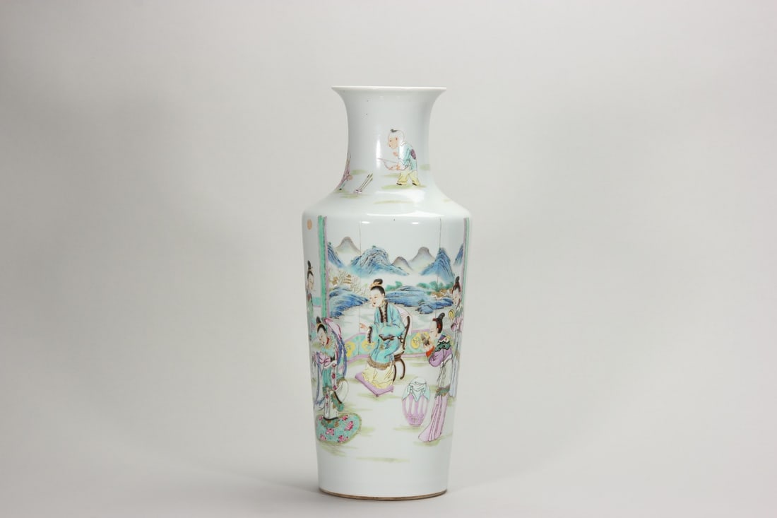A FINE YONGZHENG PERIOD FAMILLE ROSE GUANYIN VASE: H: 16.97" (H:43.1cm)A fine Yongzheng period famille rose Guanyin vase, elegantly potted with smooth white glaze. Finely painted with ladies and boys in a garden scene, delicate brushwork, soft palette