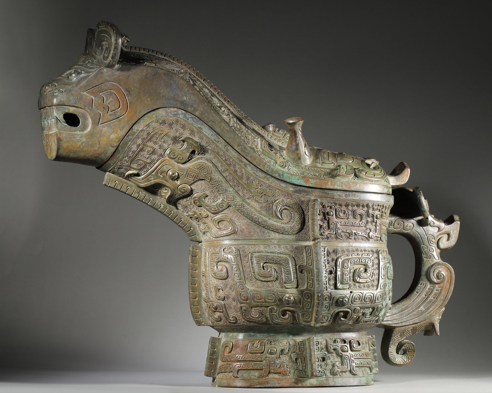 AN IMPORTANT ARCHAIC BRONZE ANIMAL-FORM RITUAL VESSEL (GONG), EARLY WESTERN ZHOU DYNASTY (1 of 12)