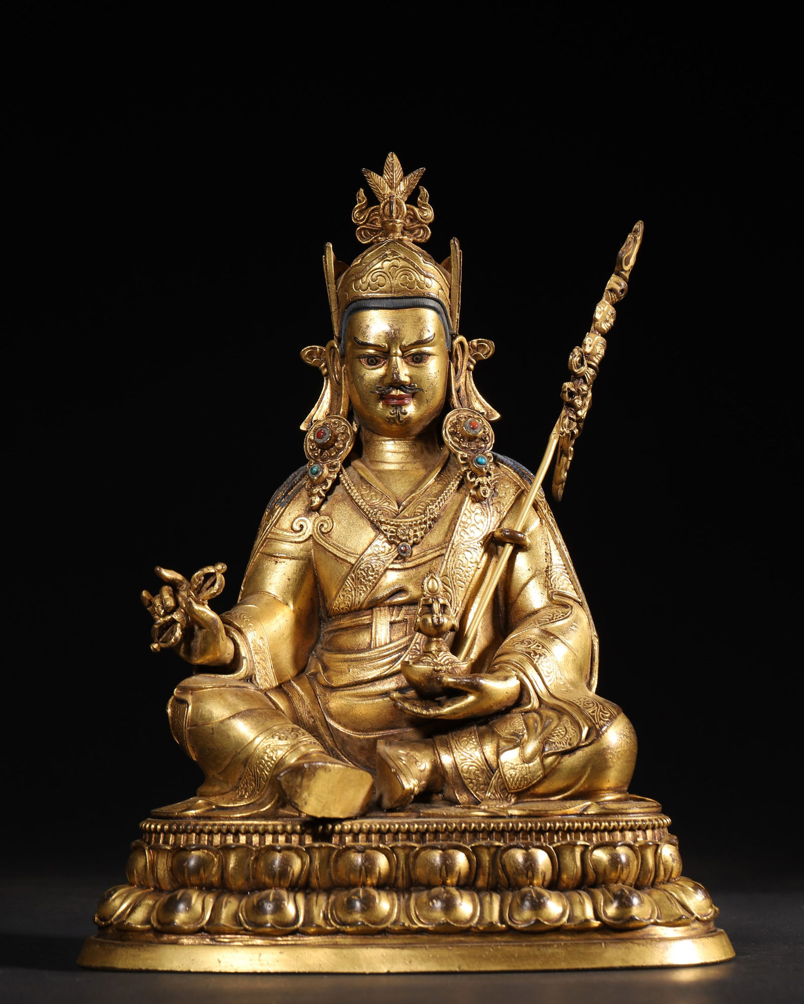 COMMISSIONED GILT-BRONZE FIGURE OF PADMASAMBHAVA, QING DYNASTY, QIANLONG PERIOD (1 of 8)