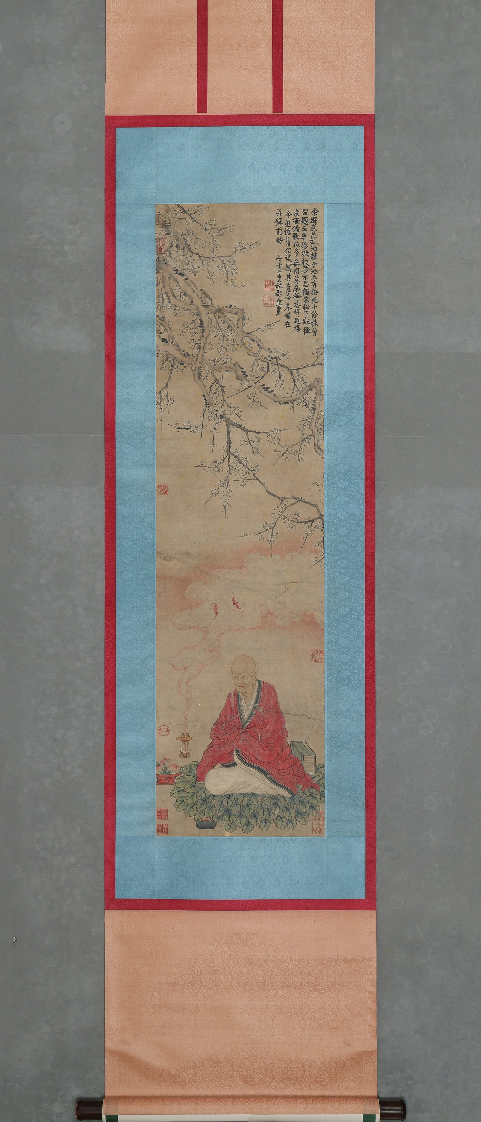 QING DYNASTY: JIN NONG - 'ARHAT IN PLUM GROVE' - HANGING SCROLL, PAPER: Heart Size: 46.85" x 12.6" inches (119 cm x 32 cm)Qing Dynasty, Jin Nong, Arhat in Plum Grove, ink and color on paper, hanging scroll. Inscribed "Jin Nong of Hangjun, aged 72”, depicting an arha