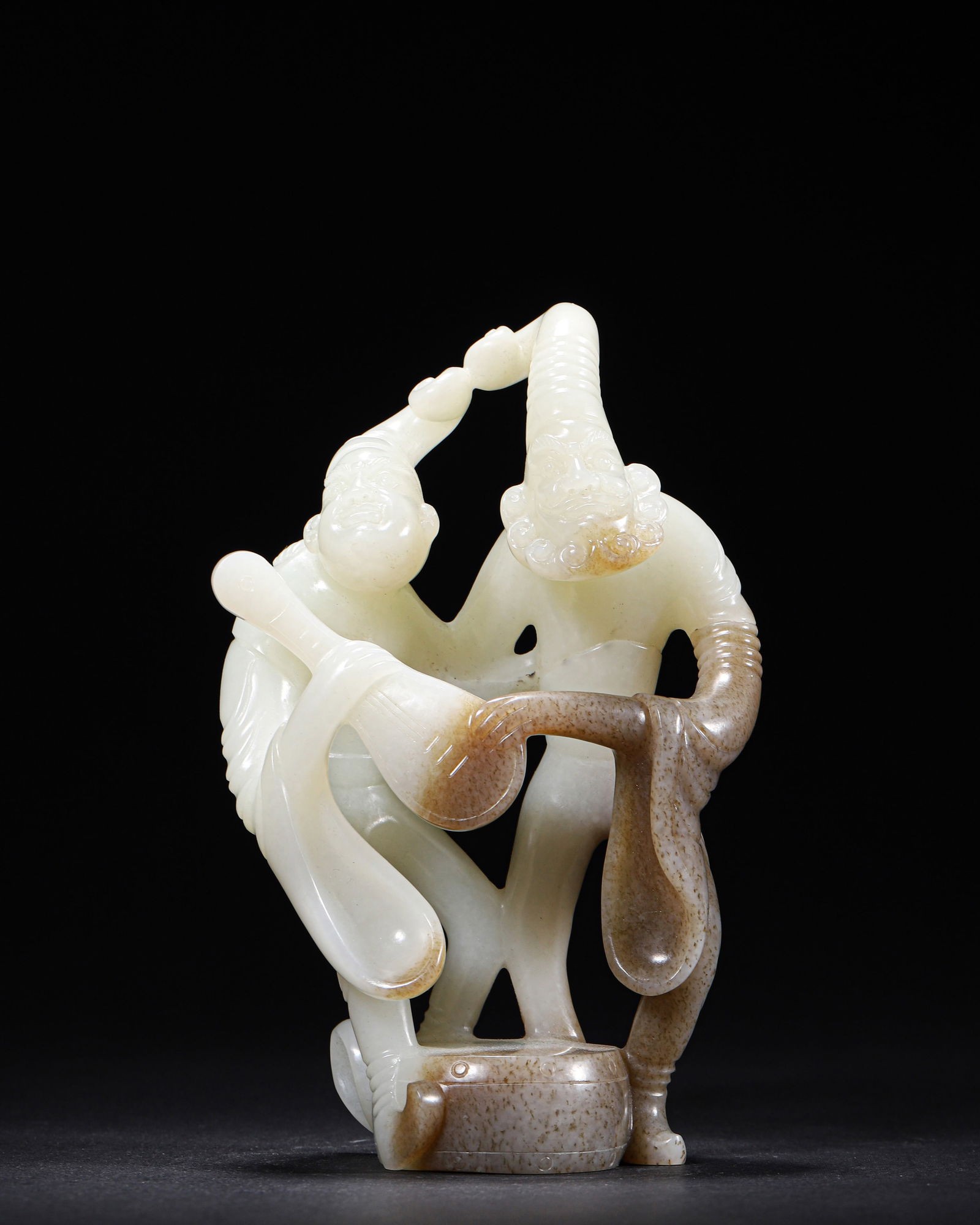TANG DYNASTY, A CARVED HETIAN JADE FIGURE OF DANCING HU LADIES (1 of 9)