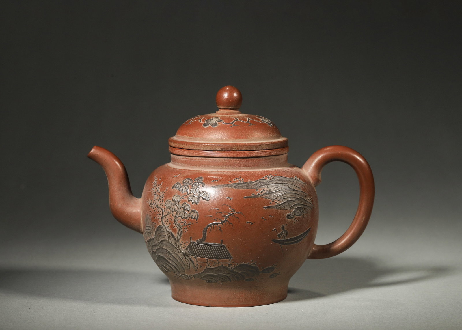 A FINE MID-QING DYNASTY (18TH–19TH CENTURY) ZISHA TEAPOT WITH BLACK CLAY RELIEF LANDSCAPE AND (1 of 9)