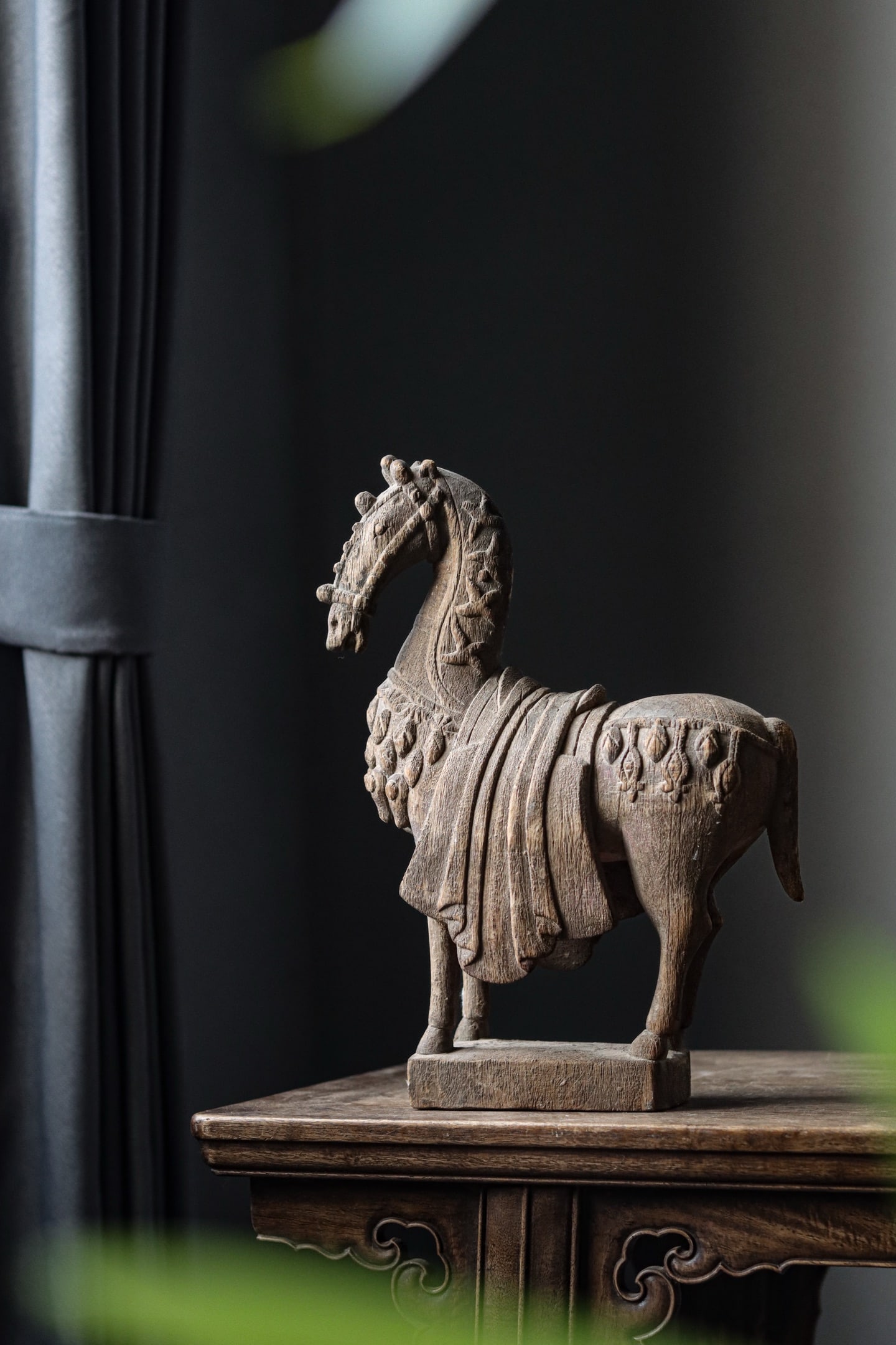 WOOD CARVED CAPARISONED HORSE, TANG DYNASTY: 12.99" x 3.94" x 9.45" inches (33cm x 10cm x 24cm)Lifelike in shape with smooth lines, the figure has a robust and powerful physique, bright piercing eyes, and an awe?inspiring, majestic bearing.