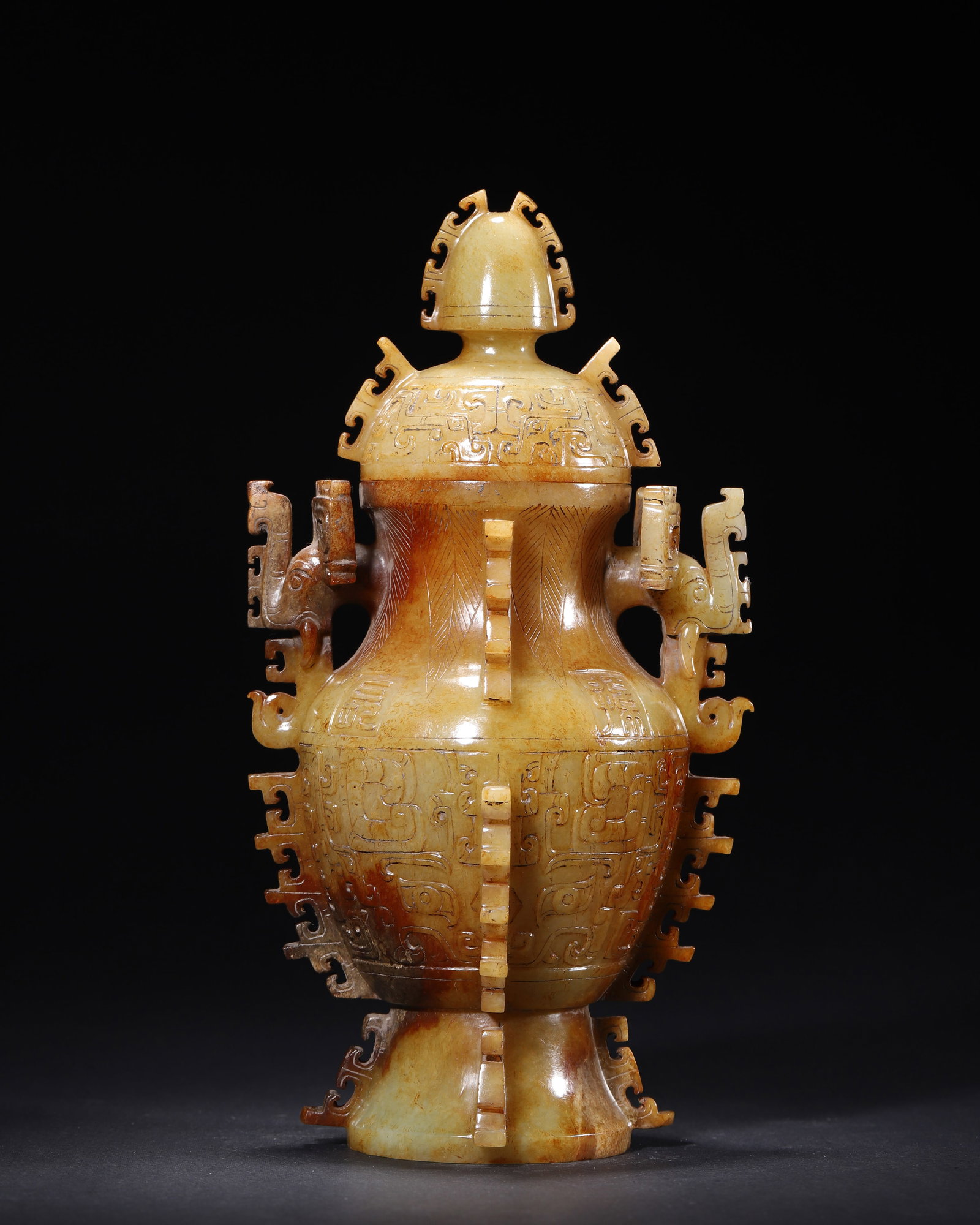 WESTERN ZHOU DYNASTY, A HETIAN YELLOW JADE COVERED HU VASE WITH PHOENIX HANDLES AND SERRATED FLANGES (1 of 8)