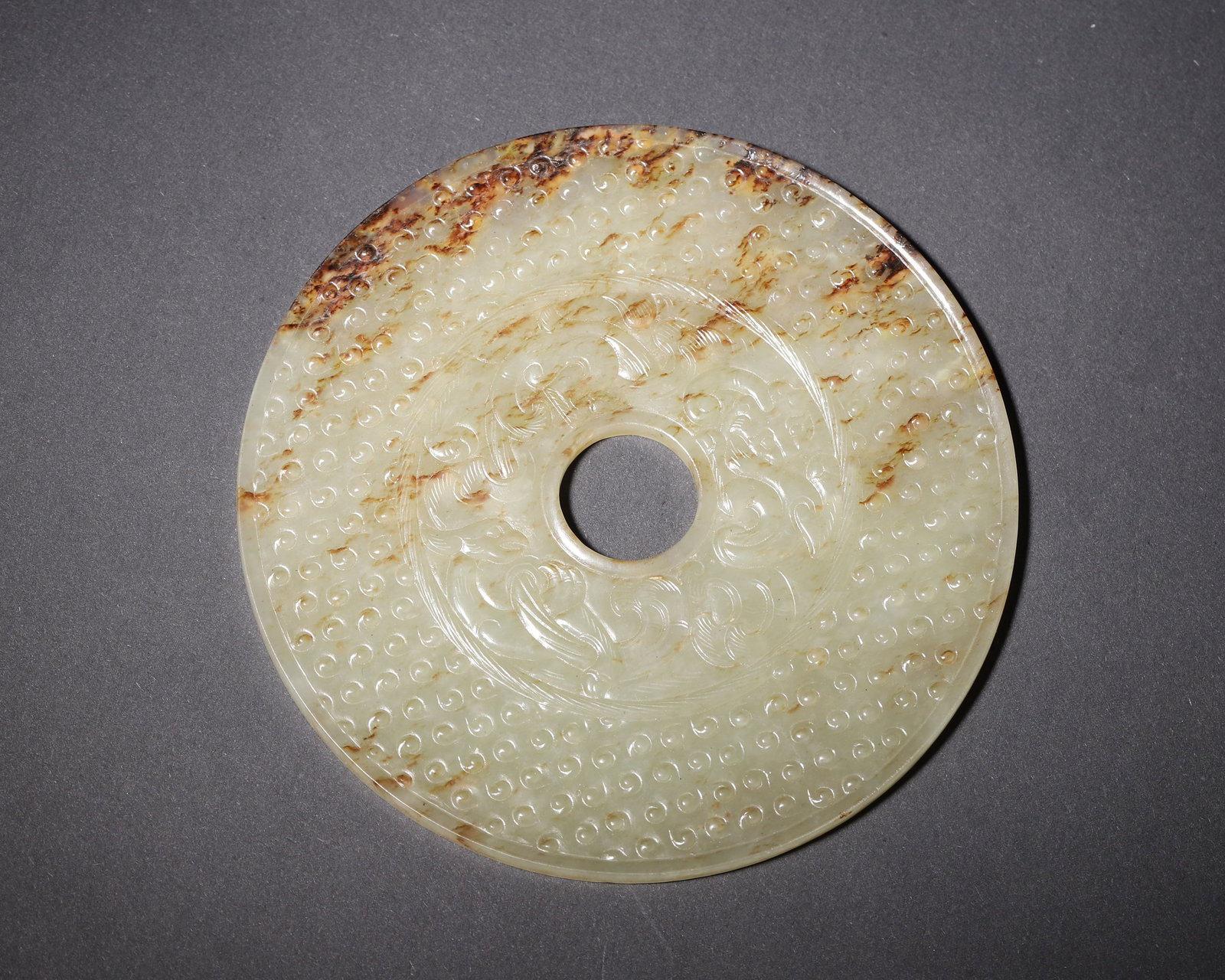 HAN DYNASTY, A WHITE JADE BI DISC WITH GRAIN PATTERN AND DOUBLE CHI DRAGON DESIGN (1 of 8)