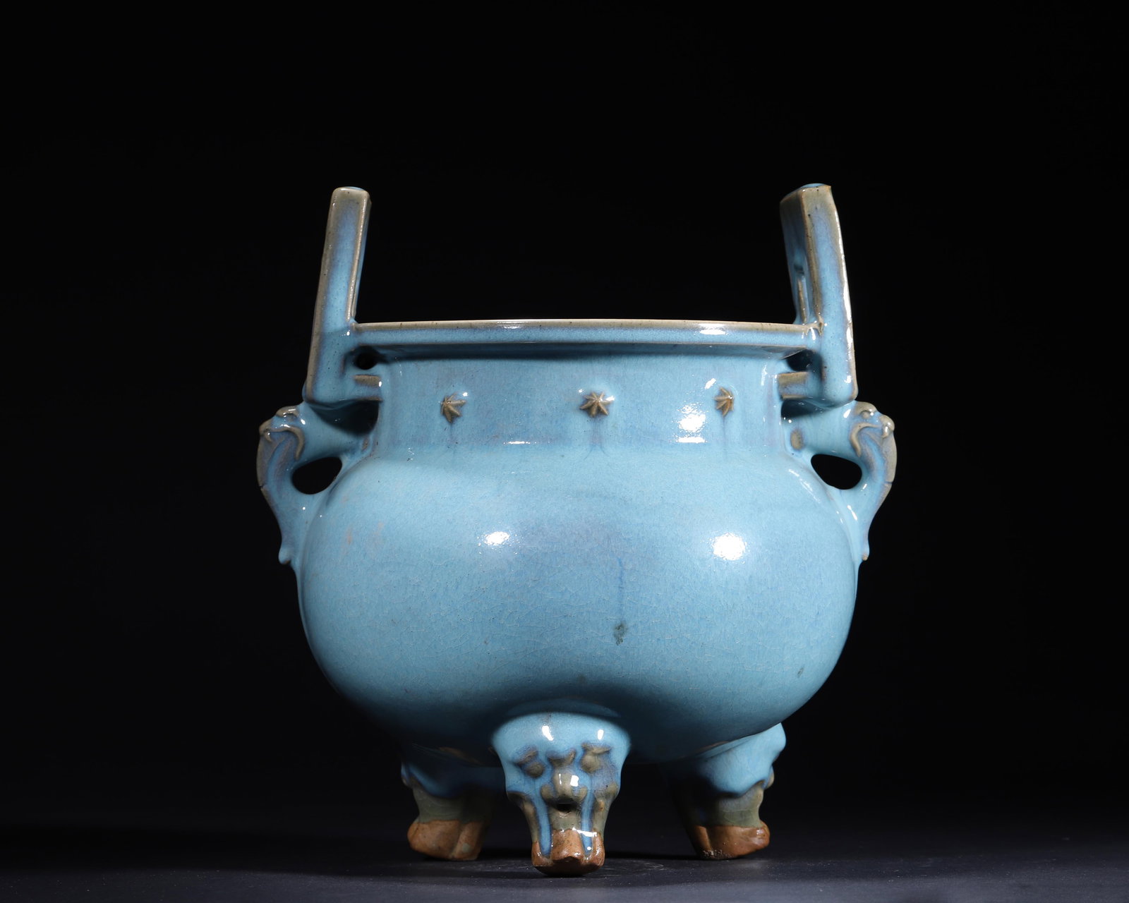 CHINESE JUN KILN SKY-BLUE GLAZED TRIPOD CENSER WITH BEAST FEET AND HANDLES, NORTHERN SONG DYNASTY: 10.24in x 10.63in (26.0cm x 27.0cm)This Northern Song Jun kiln censer features serene sky-blue glaze, archaic tripod form, and beast feet. It embodies superb Jun kiln craftsmanship, holding great hist