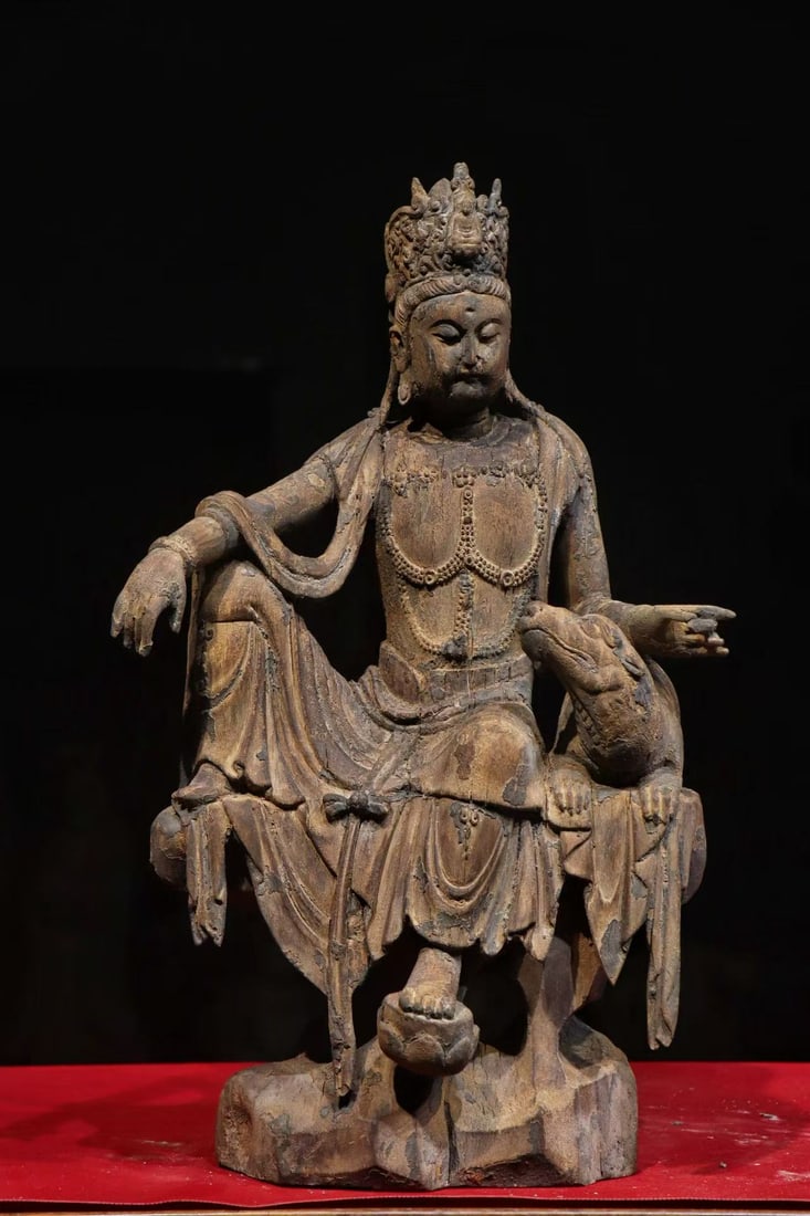 A CARVED WOOD SEATED WATER-MOON GUANYIN, MING DYNASTY (LATE MING PERIOD) (1 of 8)