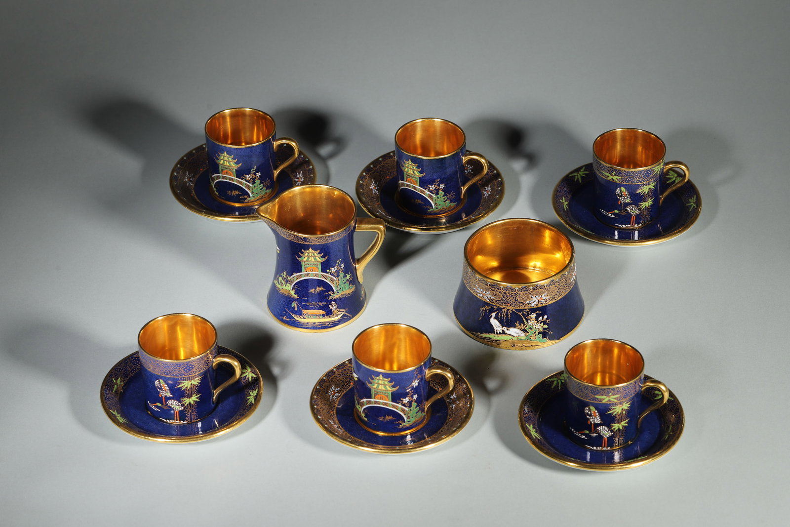 1950S CARLTON WARE CHINOISERIE COFFEE SET, 14 PIECES: 2.56in x 3.15in x 3.54in x 6.69in (6.5cm x 8.0cm x 9.0cm x 17.0cm)A 1950s Carlton Ware blue ground Chinoiserie coffee set, 14 pieces. Gilt decoration, gilt interior, Stoke-on-Trent, excellent conditio