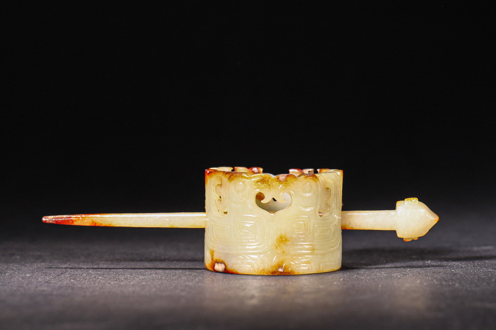 A Hetian Jade Beast-Face Hair Ornament - Shang/Zhou Dynasty: Length 13.5cm (5.31in), Width 5.0cm (1.97in), Weight 50.0g (0.11lb)This Shang/Zhou Dynasty jade hair ornament is finely carved from Hetian jade with natural aged patina. It features beast-face and spi