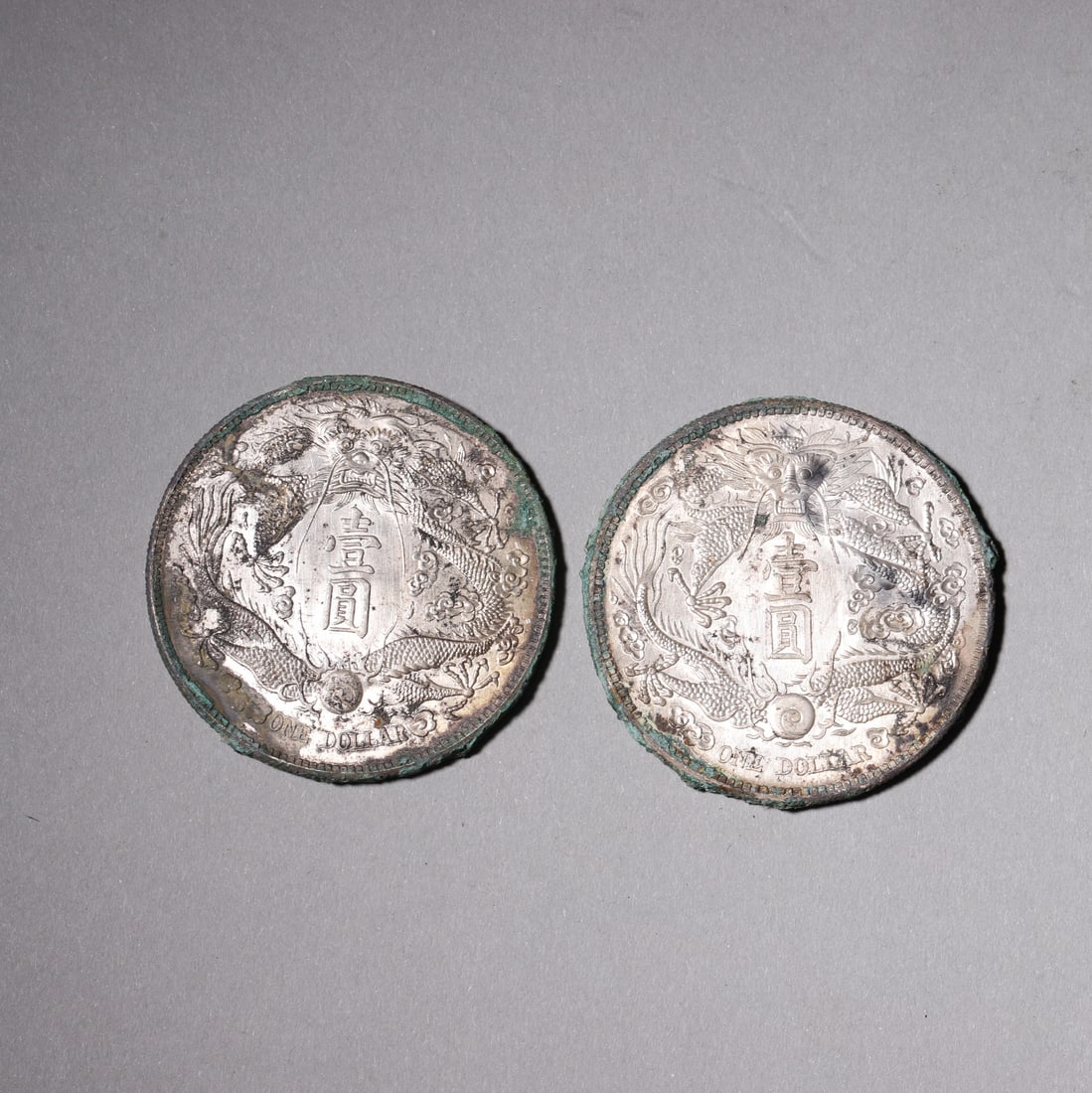 Two Great Qing Silver Coins, 1 Yuan: Diameter 4.0cm (1.57in), Weight 55.0g (0.12lb)These two Great Qing silver coins feature clear characters, vivid dragon patterns, and natural patina, embodying the charm and historical value of ancient