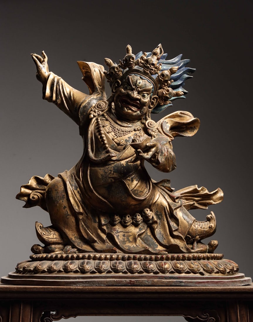 A Gilt Bronze Statue of Vajrapani Bodhisattva, Qing Dynasty: Net Weight 61.8jin (68.12 lb); Height 63cm (24.8 in); Width 62cm (24.41 in); Thickness 31cm (12.2 in)This gilt bronze statue of Vajrapani Bodhisattva dates back to the Qing Dynasty. It features a dign