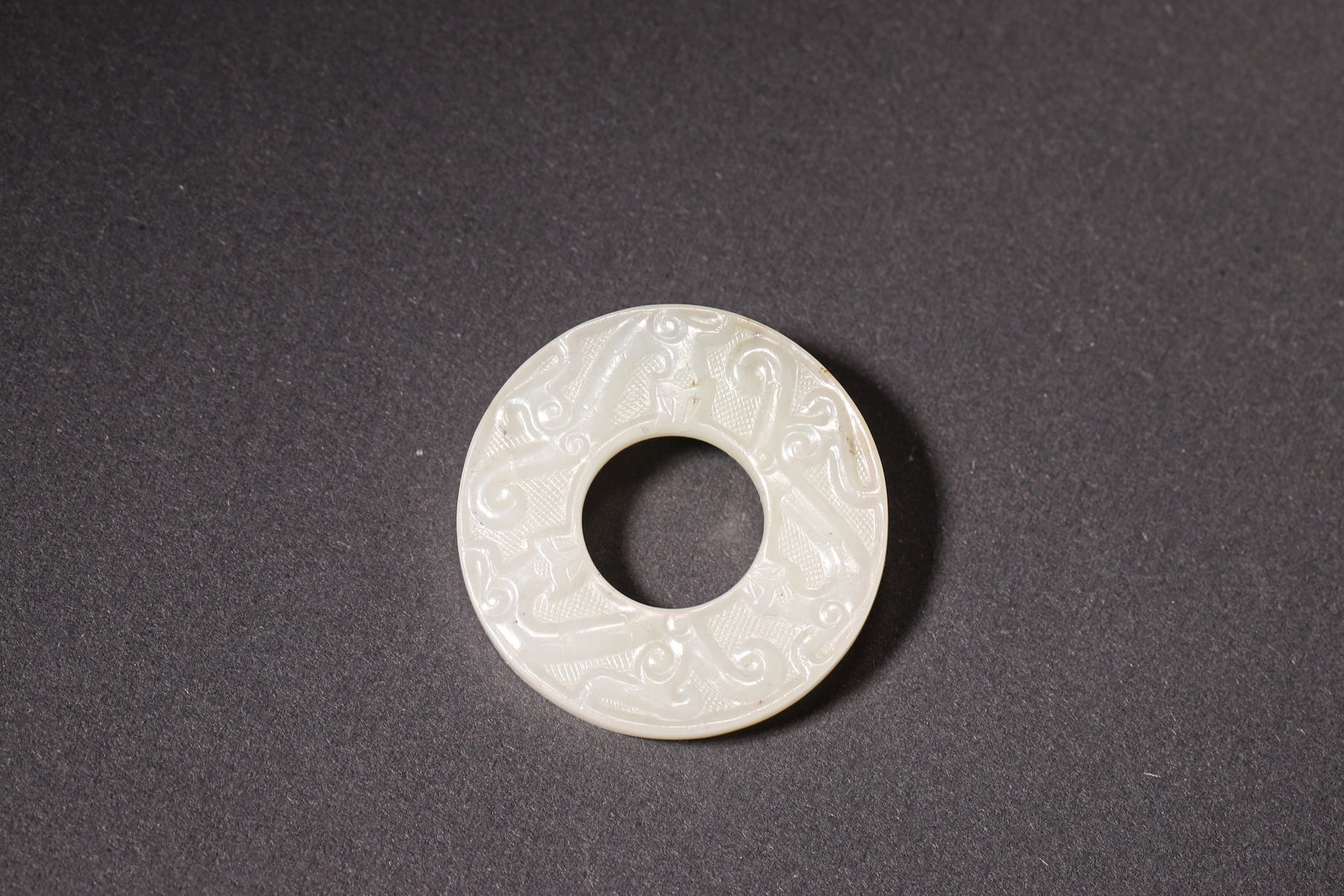 A Hetian Jade Bi-Shaped Pendant with Chi Dragon Pattern - Han Dynasty (1 of 6)
