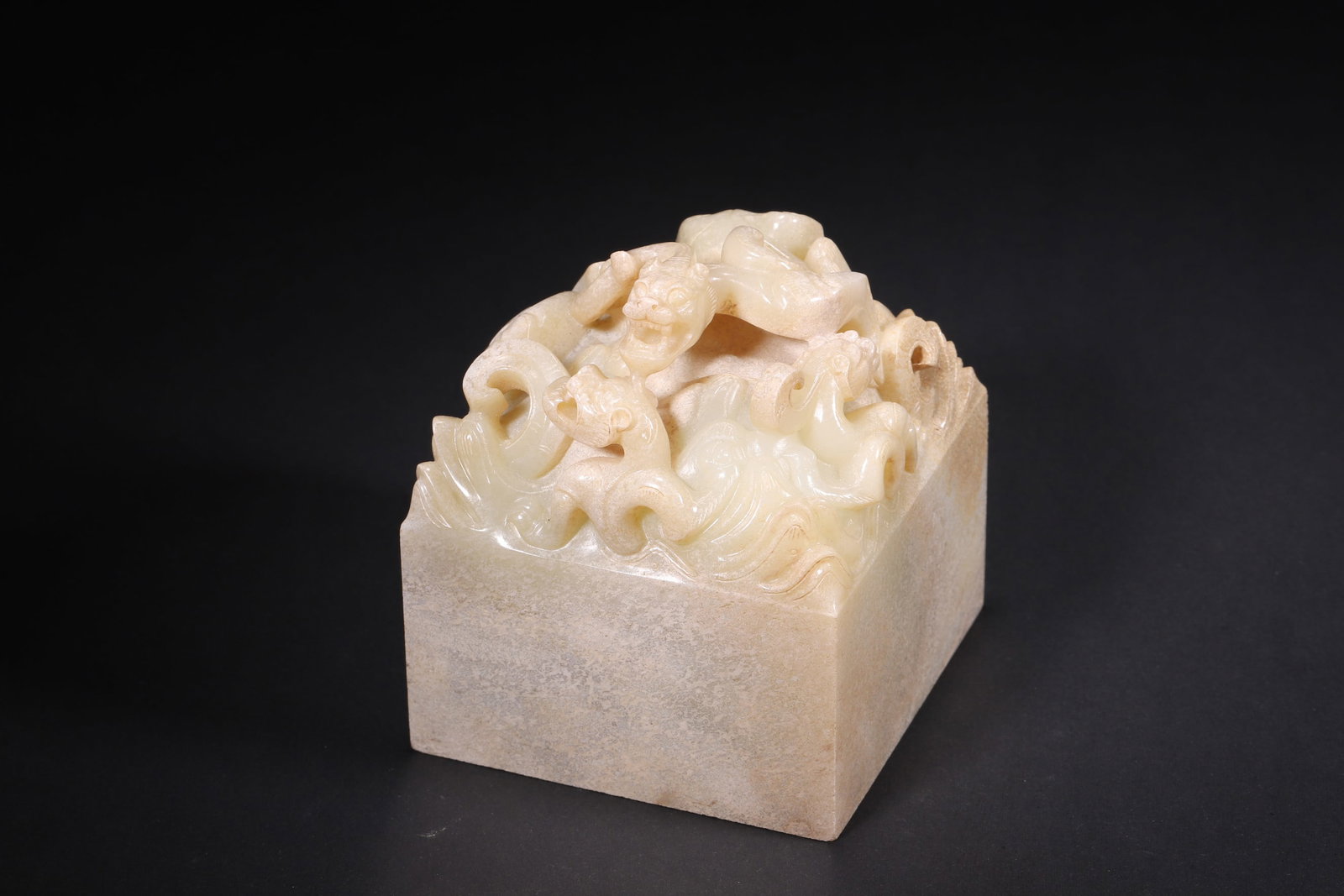 A High Ancient Jade Seal with Multi-Chilong Knob, Han Dynasty: Length 8.0cm (3.15in), Width 8.0cm (3.15in), Height 9.5cm (3.74in), Weight 1357.0g (2.99lb)This is a rare Han Dynasty high ancient jade seal with a multi-chilong knob. Carved with powerful interwoven 