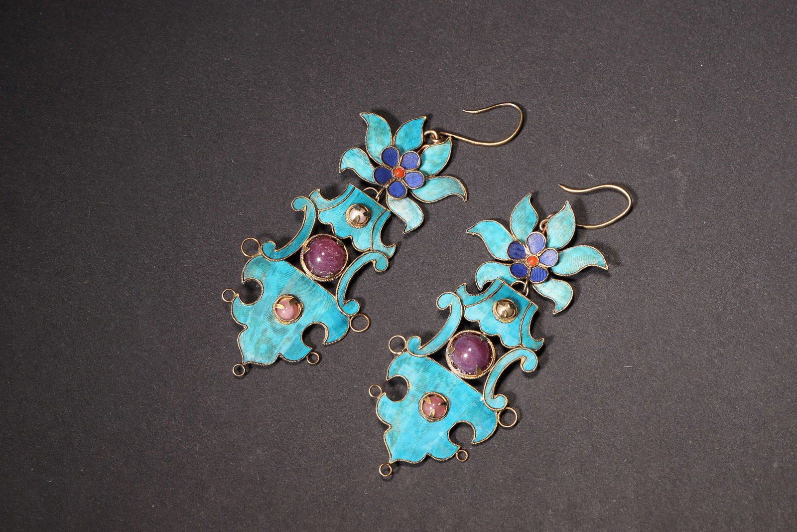 A Pair of Silver-Gilt Kingfisher Feather Earrings with Gemstone Inlay (Qing Dynasty): Length 8.0cm (3.15in), Width 3.0cm (1.18in), Weight 10.0g (0.02lb)This pair of Qing Dynasty earrings is crafted from silver-gilt with kingfisher feather and gemstone inlay. They feature elaborate flor