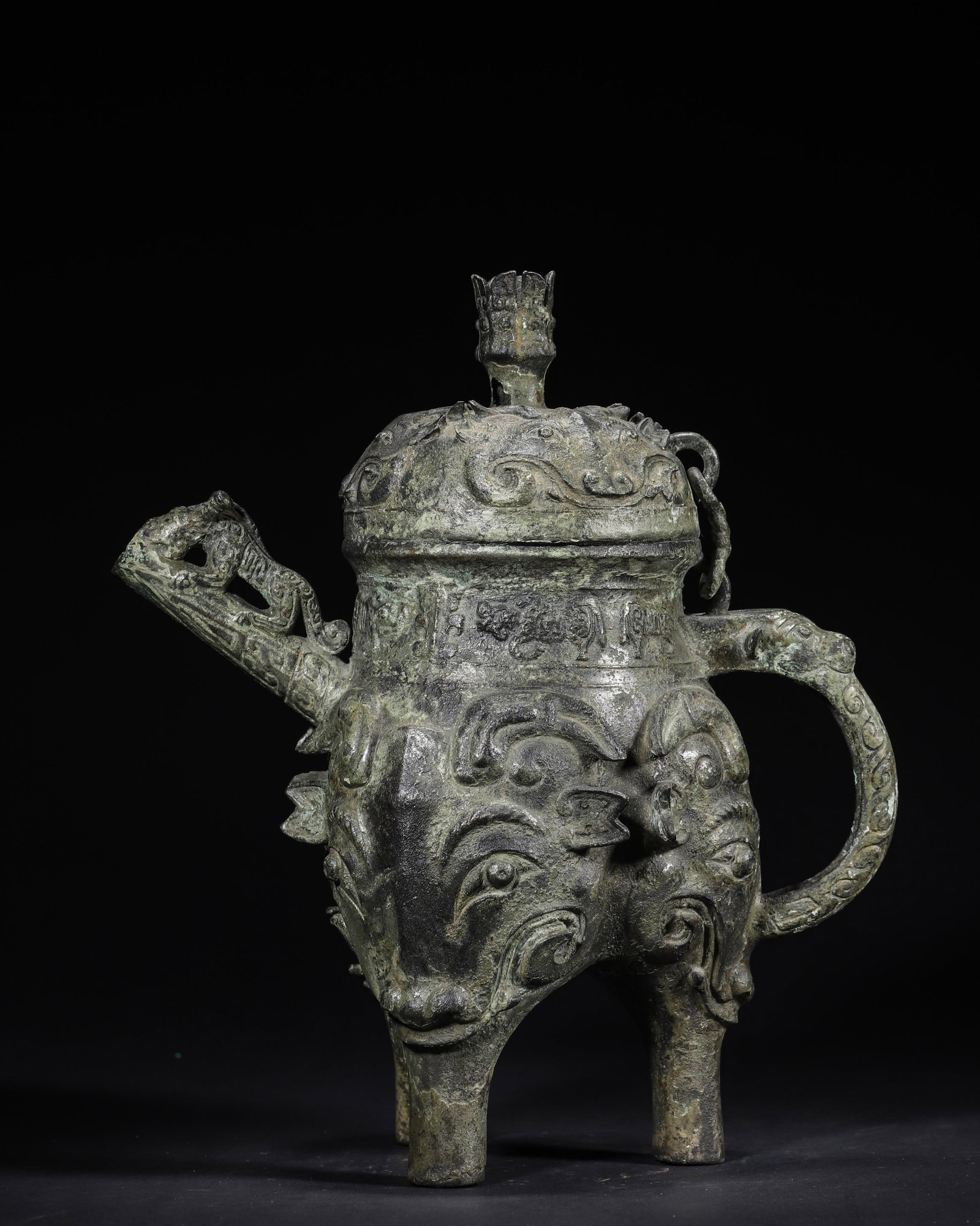A Bronze Tripod He Vessel with Animal Mask Design, Shang-Zhou Period (1 of 8)