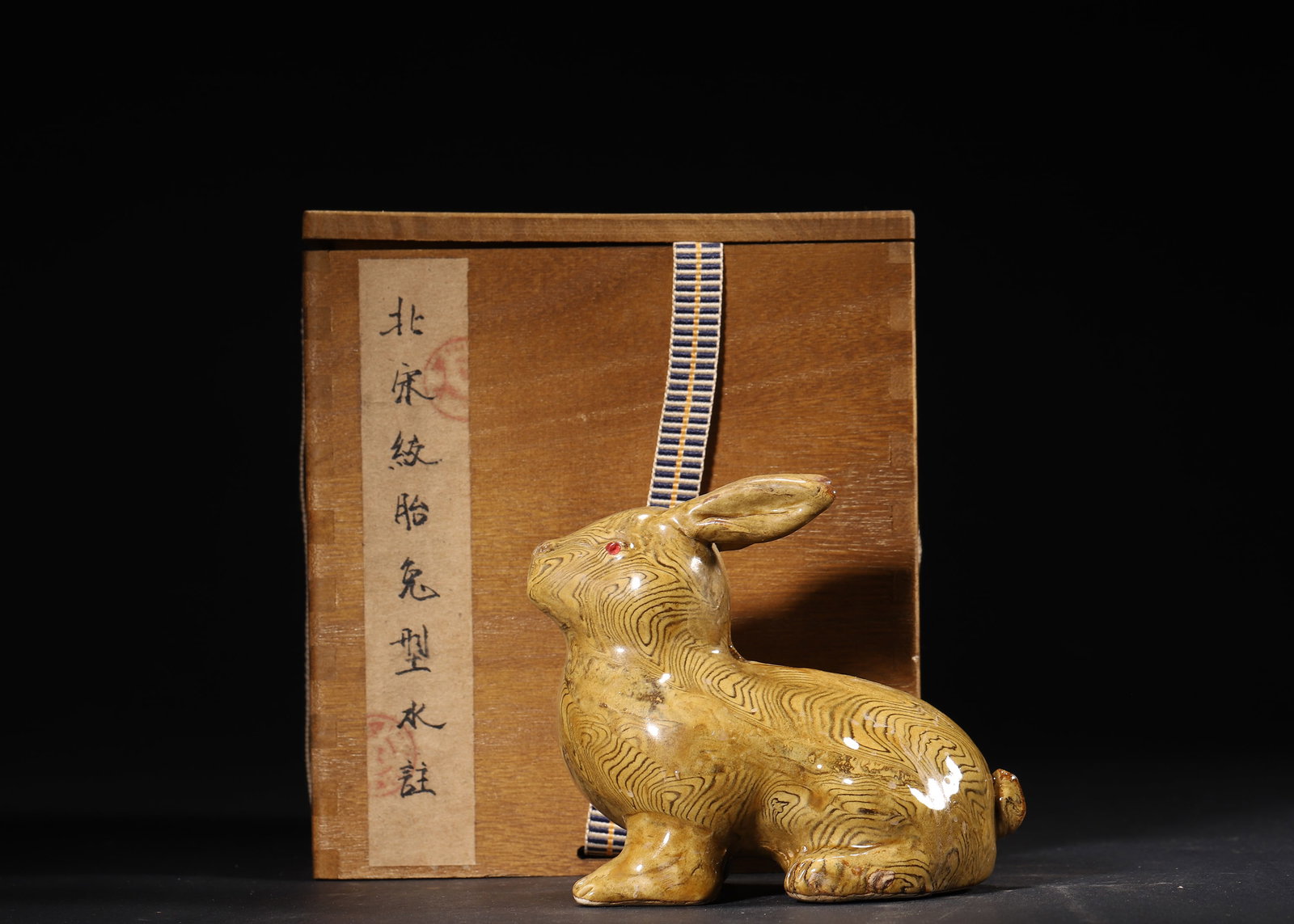 A Northern Song Jiao-Tai Glaze Rabbit-shaped Water Dropper: 10.0 x 7.0 x 10.0 cm (L x W x H = 3.94 x 2.76 x 3.94 in)This Northern Song Jiao-tai glaze rabbit-shaped water dropper features a clever and lively posture. Adorned with unique marbled patterns that cr
