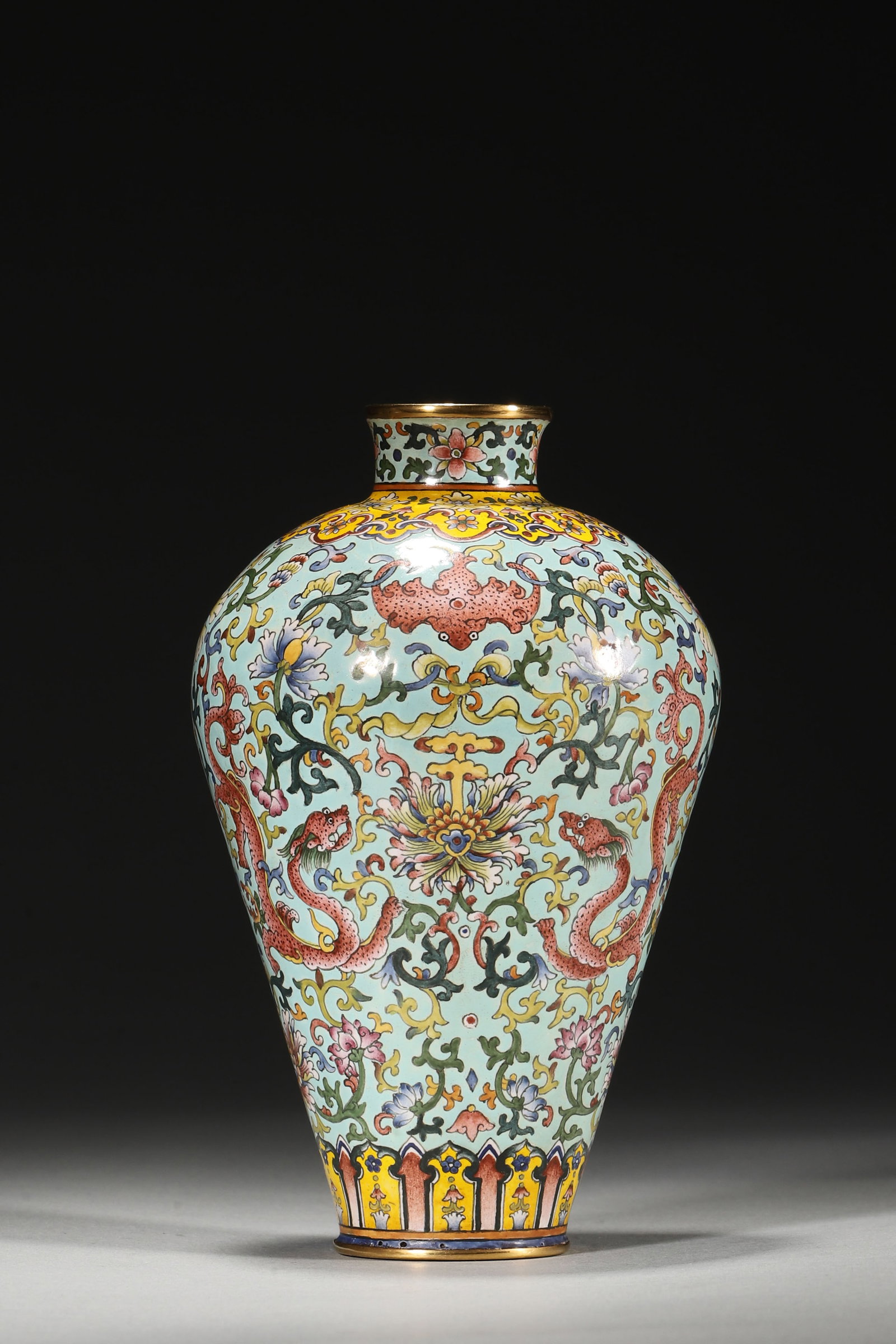 An Enameled Copper Plum Vase with Dragon and Floral Motifs, Qianlong Period: 8.0cm x 13.0cm,359.0g (3.15in x 5.12in,WT 0.7915lb)This enameled copper vase features dragons and flowers on a turquoise ground, with gilt rims and a Qianlong mark. It embodies the opulent style of im