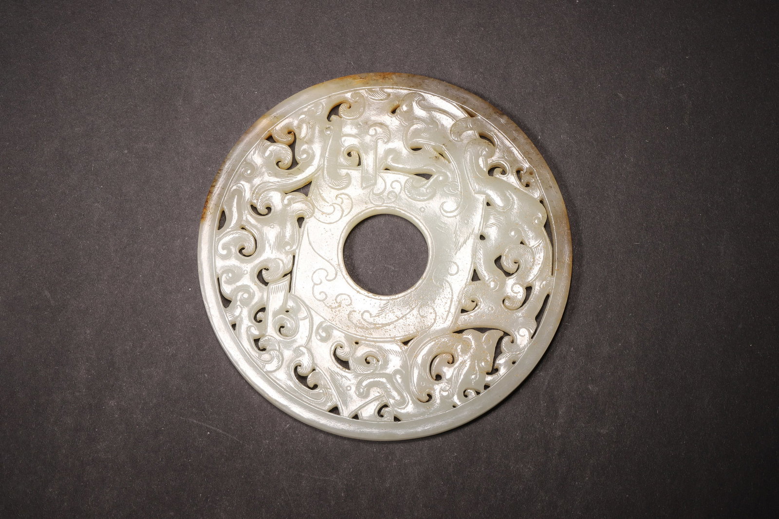 A Hetian Jade Bi Disc with Openwork Dragon and Phoenix Pattern - Han Dynasty (1 of 8)