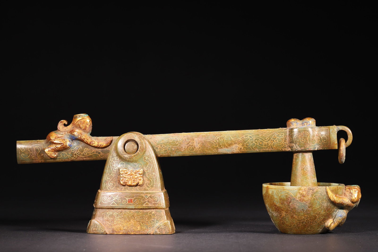 A Hetian Jade Medicine Grinder with Gold Inlaid Patterns (Han Dynasty): Length 30.0cm (11.81in), Width 7.0cm (2.76in), Height 11.0cm (4.33in), Weight 1076.0g (2.37lb)This grinder, crafted from Hetian jade, features exquisite gold-inlaid patterns and gilded carvings. It sh
