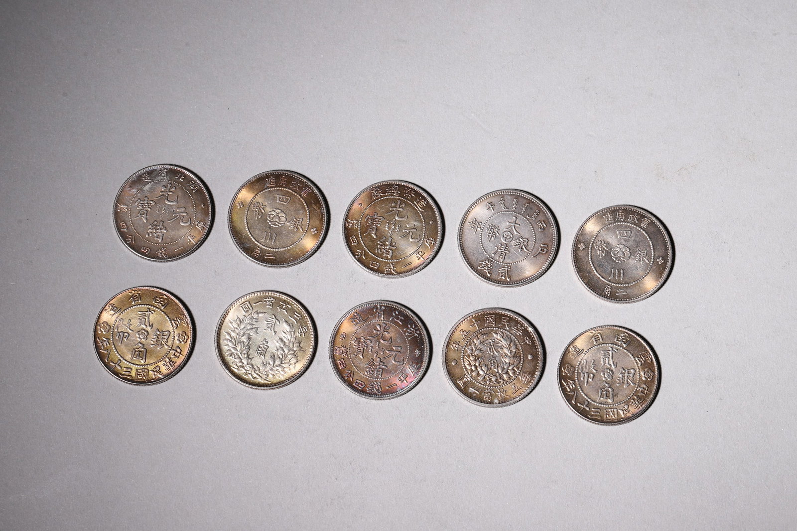 A Group of Ten Silver Coins with Dragon and Building Designs - 2