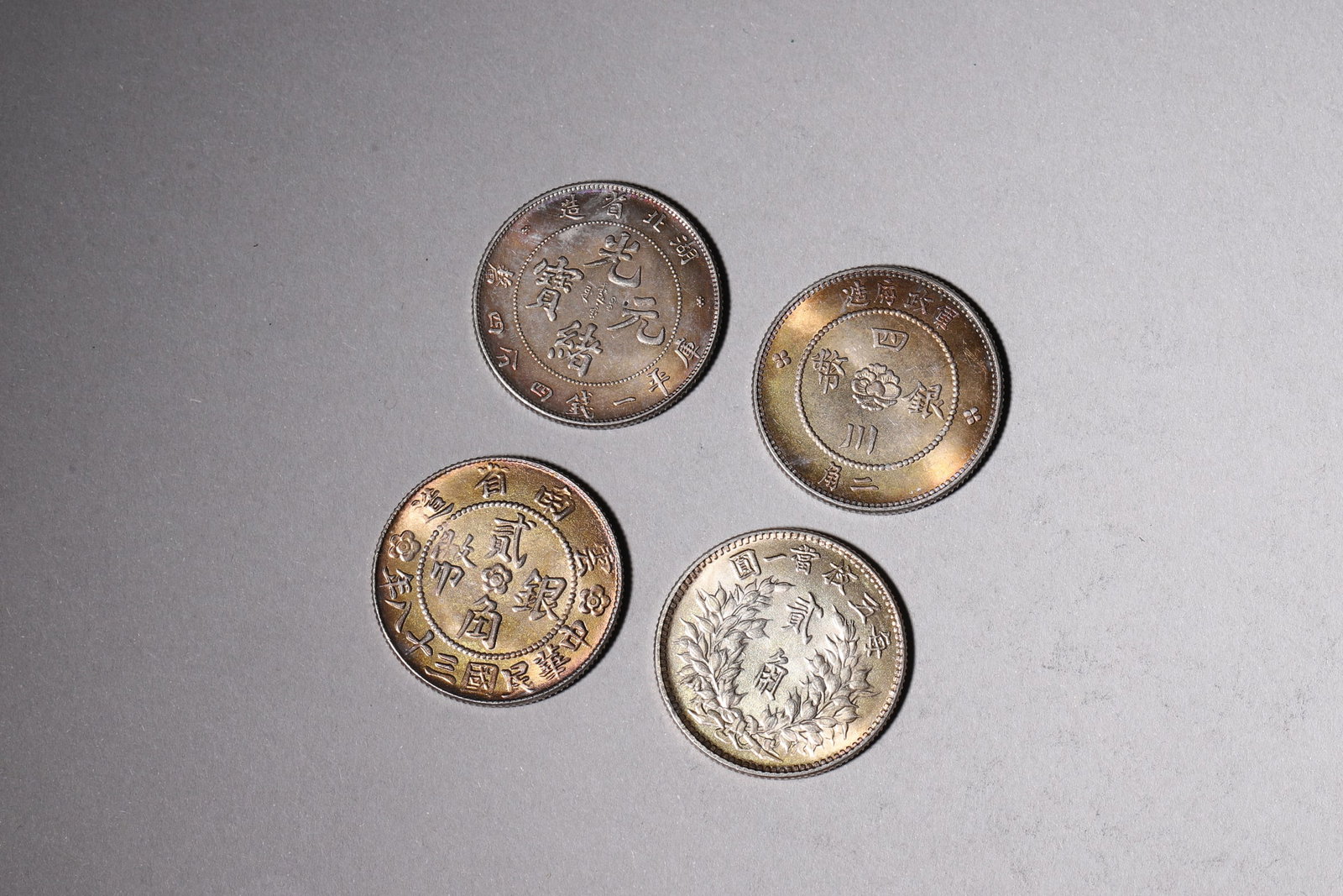 A Group of Ten Silver Coins with Dragon and Building Designs - 3