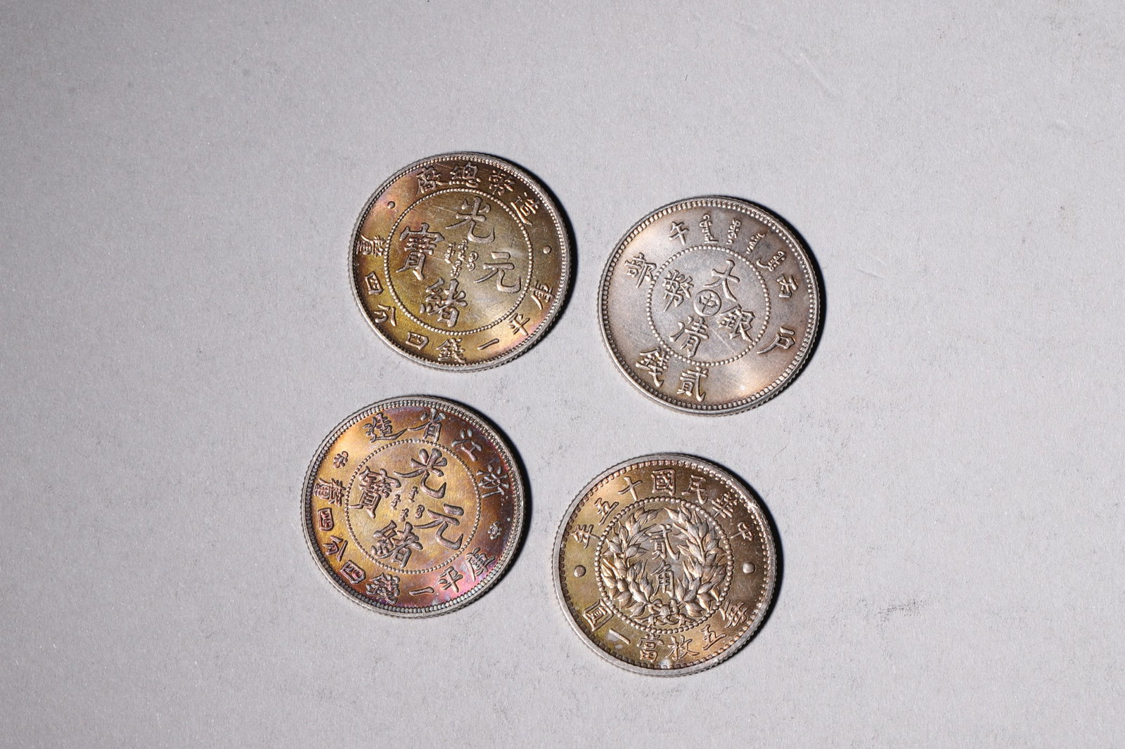 A Group of Ten Silver Coins with Dragon and Building Designs - 5