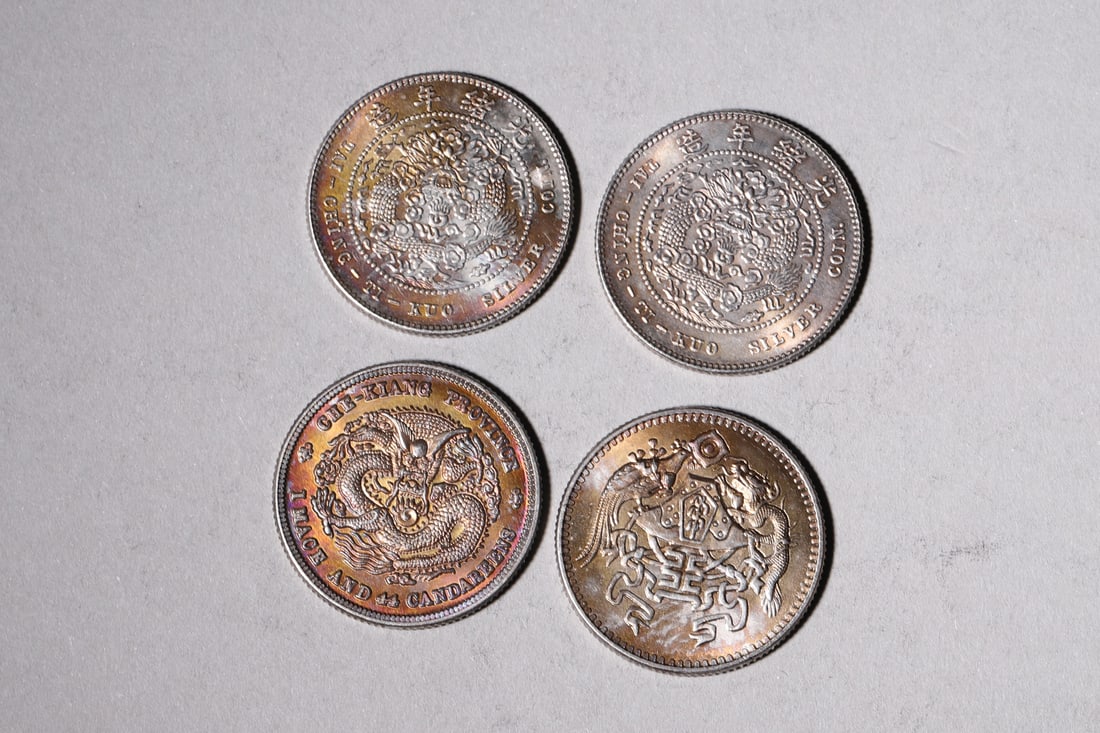 A Group of Ten Silver Coins with Dragon and Building Designs - 6