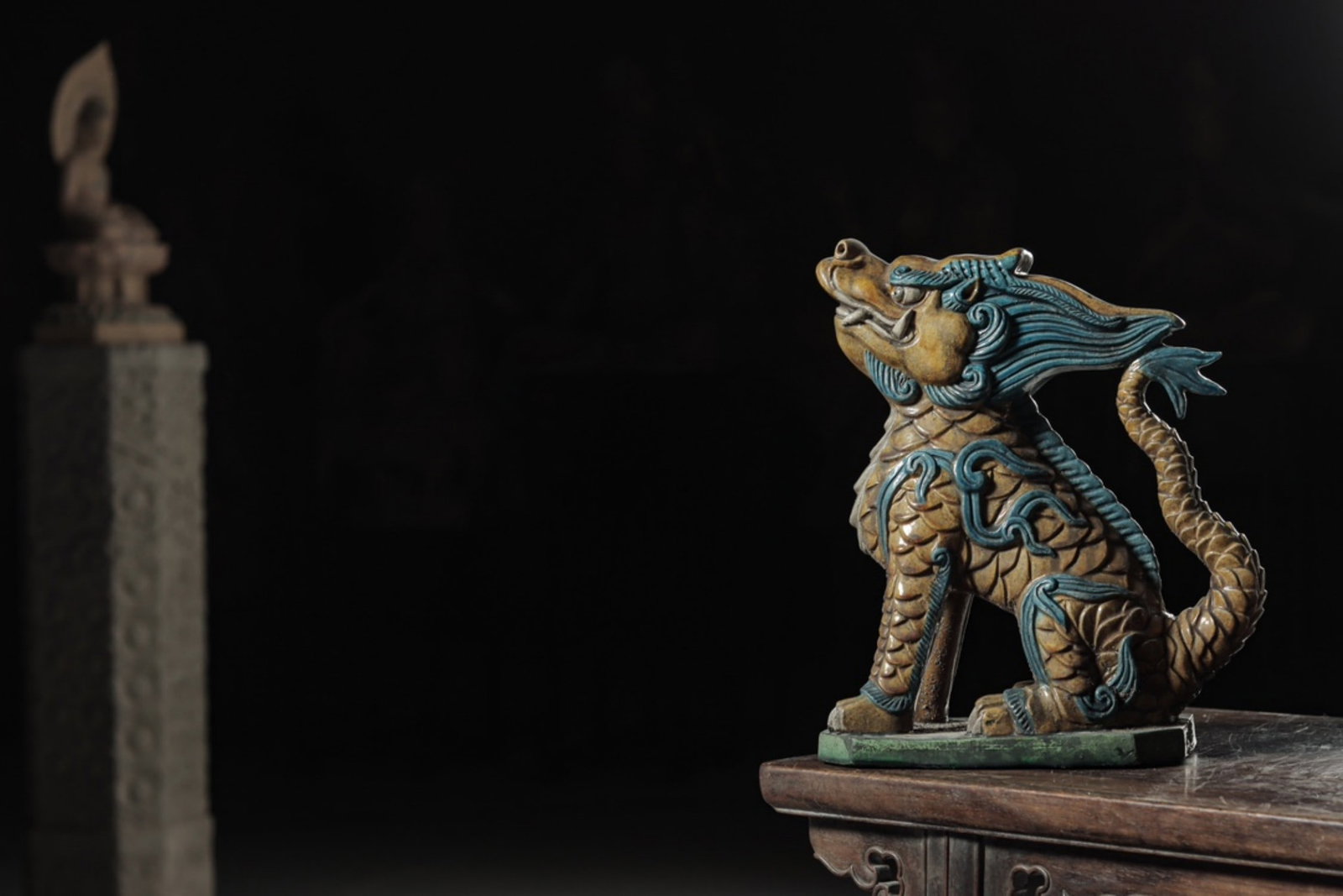 A Glazed Tile Ornament of a Mythical Beast, Ming Dynasty: Height 33cm (12.99 in); Width 12cm (4.72 in); Length 27cm (10.63 in)A glazed tile ornament of a mythical beast from the Ming Dynasty. The beast stands proudly with flowing mane and distinct scales, fe