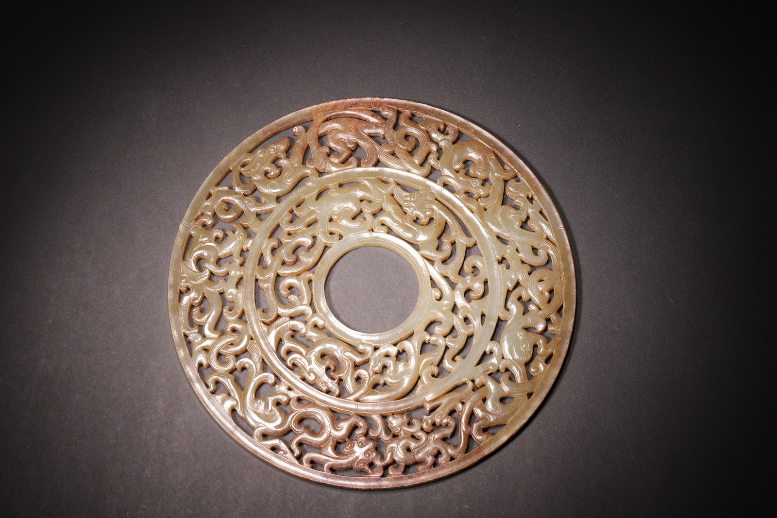 A Hetian Jade Bi Disc with Openwork Dragon Pattern - Han Dynasty (1 of 8)