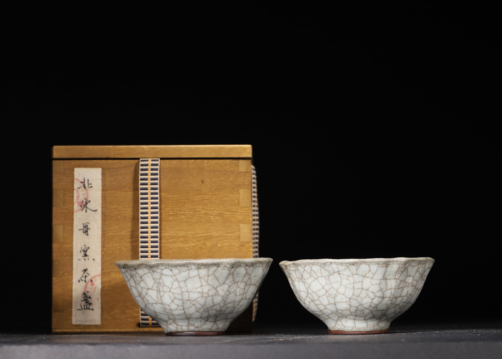 A Pair of Northern Song Ge Kiln Flower-Mouth Tea Cups: 8.5 x 8.5 x 4.0 cm (D x D x H = 3.35 x 3.35 x 1.57 in)This pair of Northern Song Ge Kiln flower-mouth tea cups features an elegant shape with flared petal-rimmed mouths, curved bodies, and ring feet, 