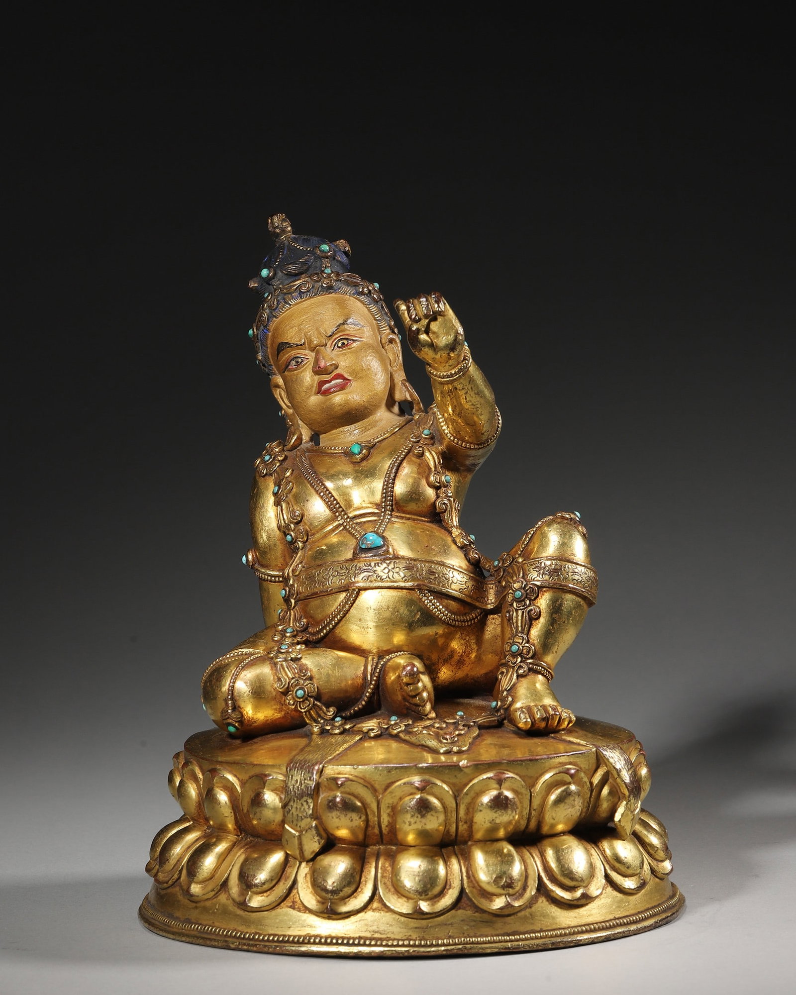 A Gilt Bronze Statue of Mahasiddha Arhat, Qing Dynasty: W 15cm (5.91 in); Wt 2488g (5.49 lb)This gilt bronze statue depicts a Mahasiddha Arhat of Tibetan Buddhism from the Qing Dynasty. It features solemn facial expression, fluent robe lines and delicately