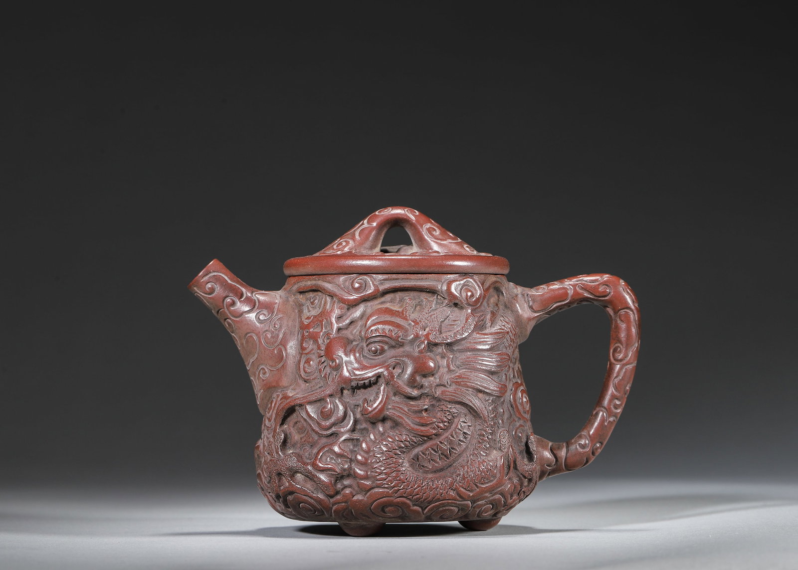 A Ming Dynasty Zisha Yixing Teapot Carved with Carp Leaping over Dragon Gate, Mark of Youquan (1 of 8)