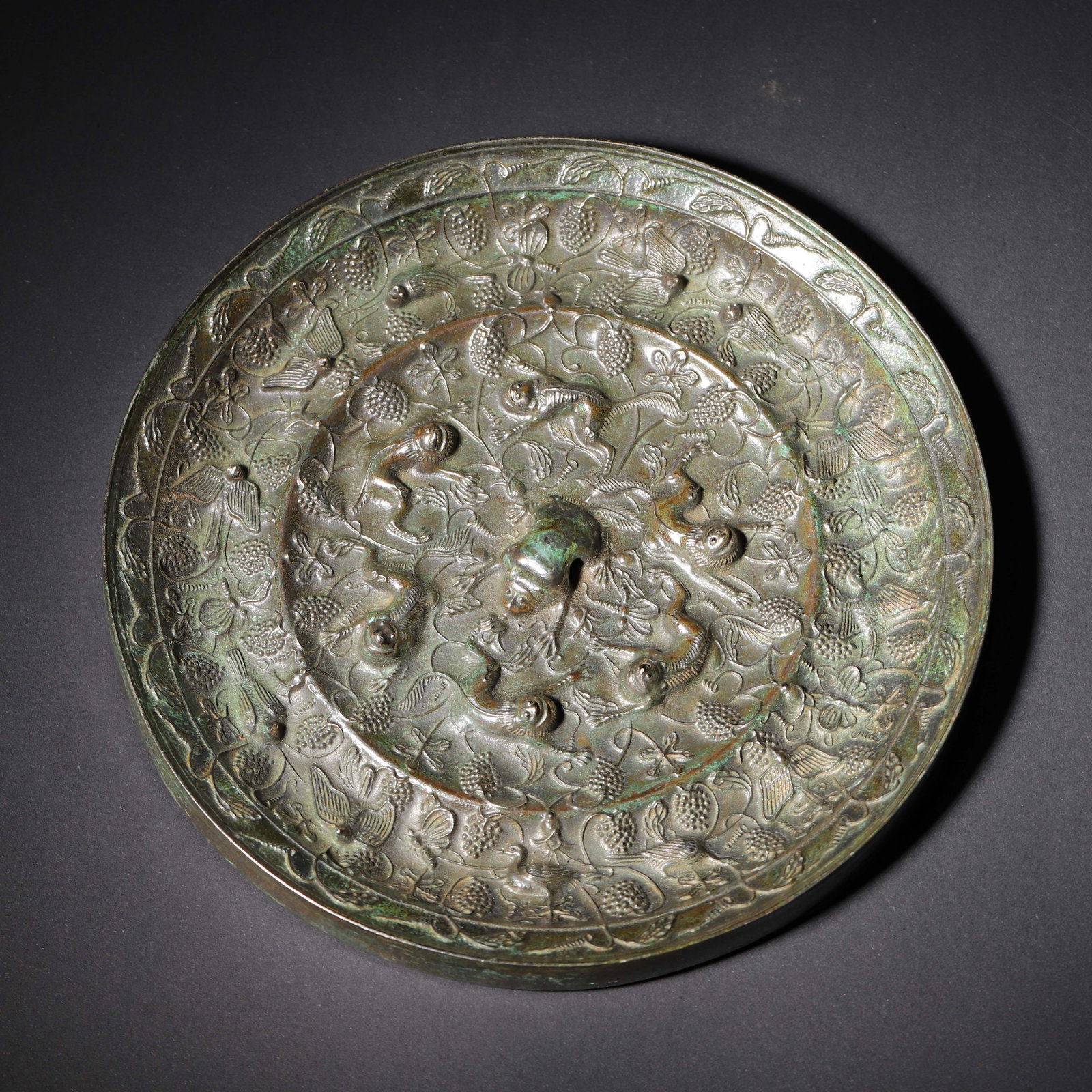 A Round Bronze Mirror with Sea Beasts and Grapes, Tang Dynasty (1 of 6)