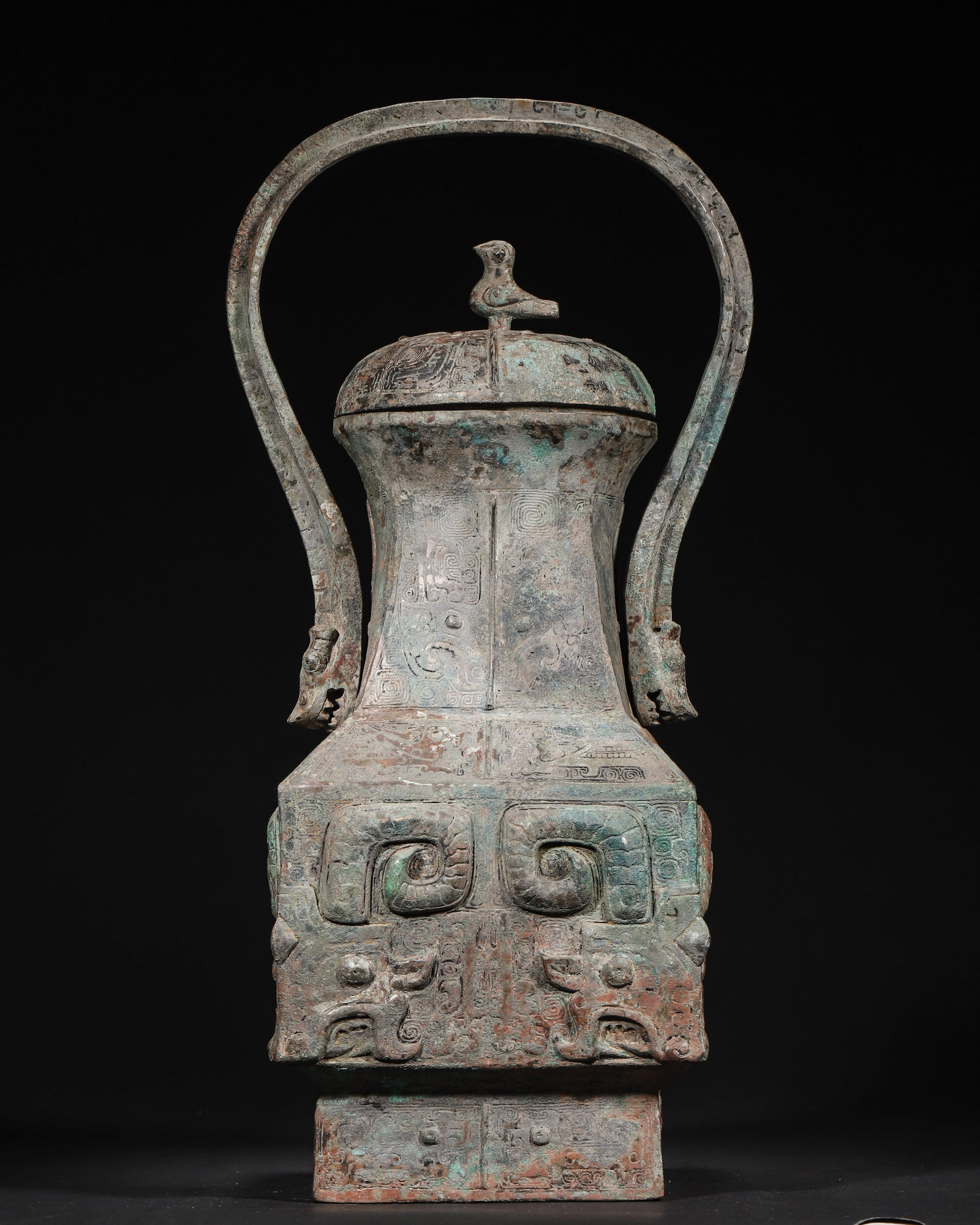 A Bronze You with Beast Mask Pattern, Bird Finial and Overhead Handle, Late Shang Dynasty (1 of 11)