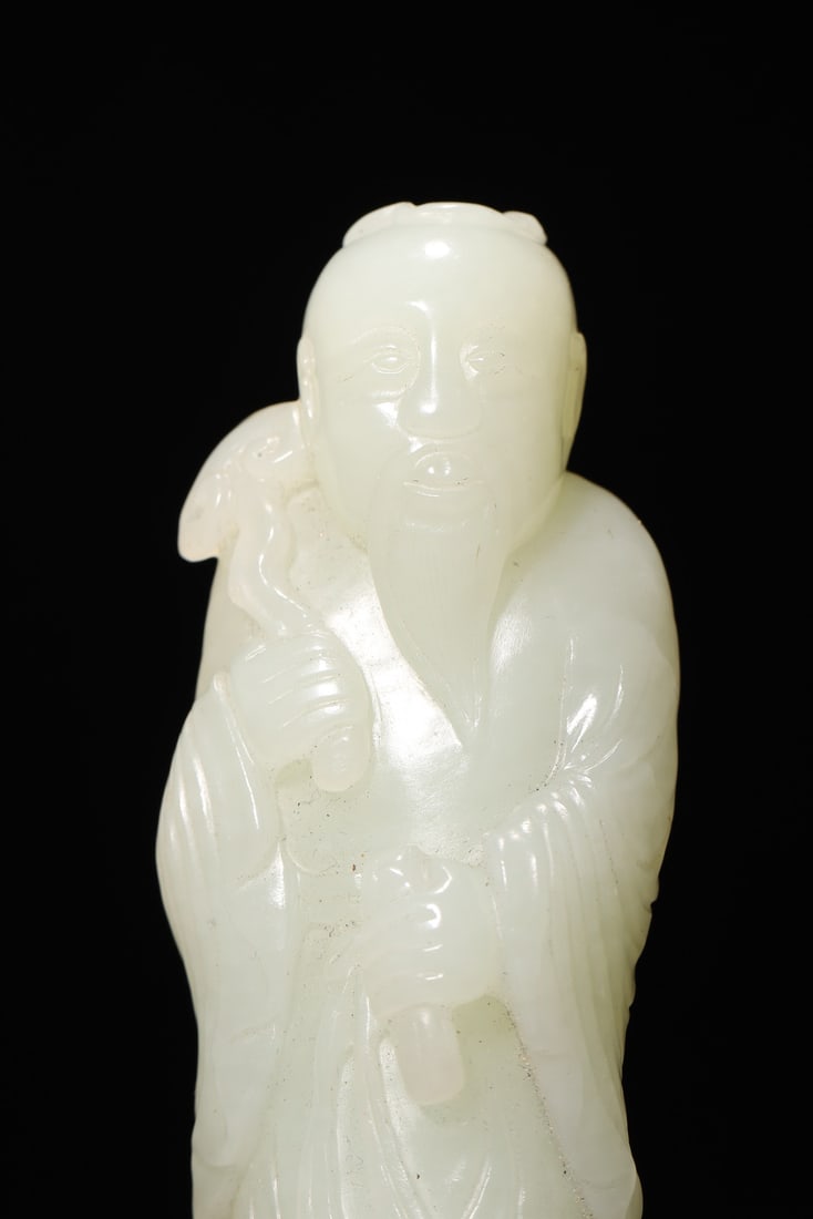 A Hetian Greenish White Jade Figure of an Immortal Holding Ruyi - Qing Dynasty - 3