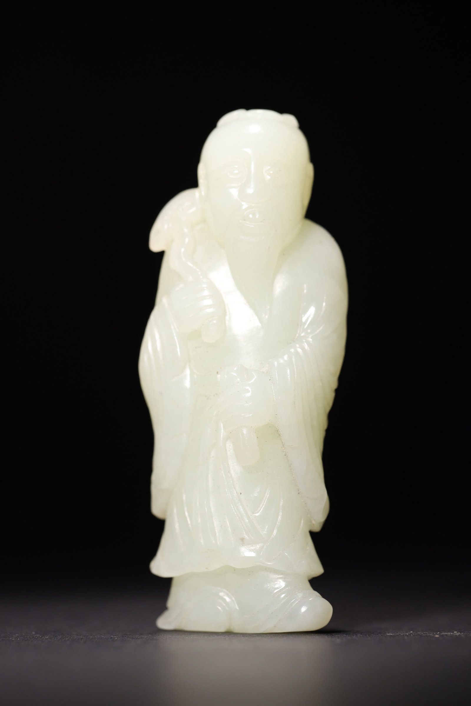 A Hetian Greenish White Jade Figure of an Immortal Holding Ruyi - Qing Dynasty - 4