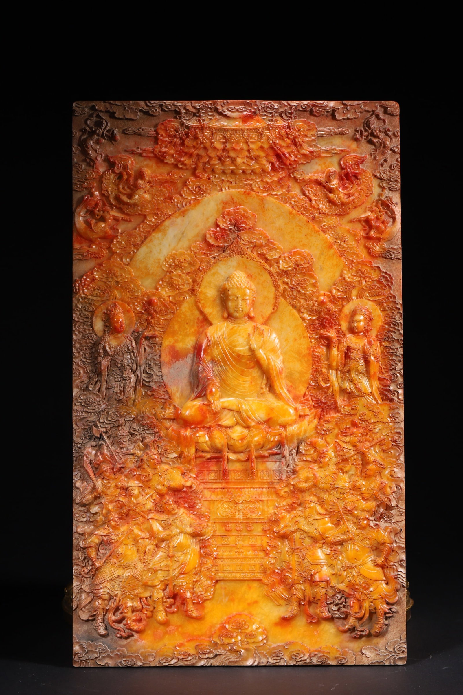 A Tianhuang Stone Carved Screen with Sakyamuni Preaching Scene, Qing Dynasty: Length 48.0cm (18.9in), Width 28.0cm (11.02in), Weight 3815.0g (8.41lb)This is a Qing Dynasty Tianhuang stone carved screen depicting Sakyamuni preaching. Made of rare Tianhuang stone with warm orange