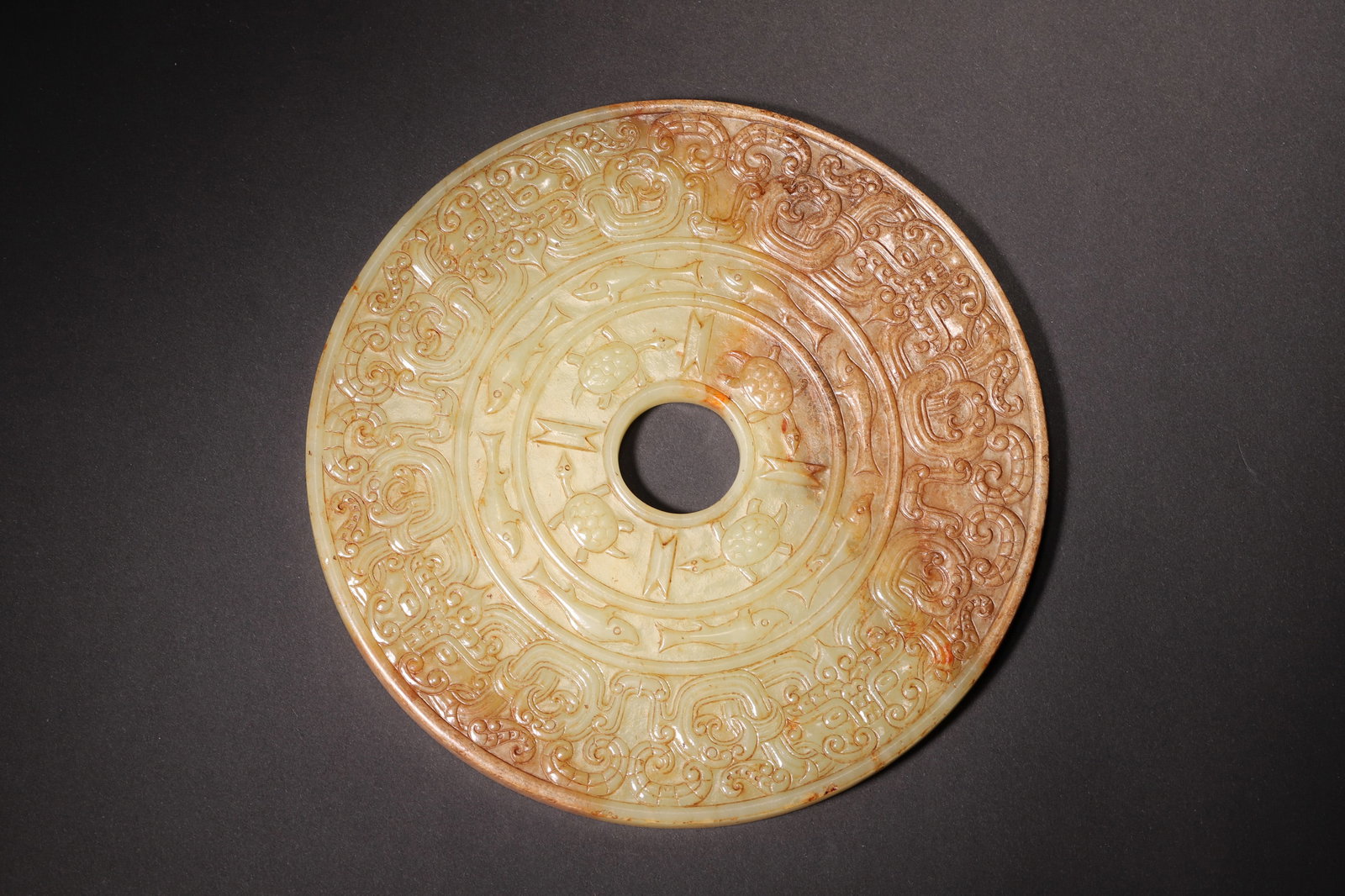 A Hetian Jade Bi Disc with Fish and Bird Pattern - Han Dynasty (1 of 8)