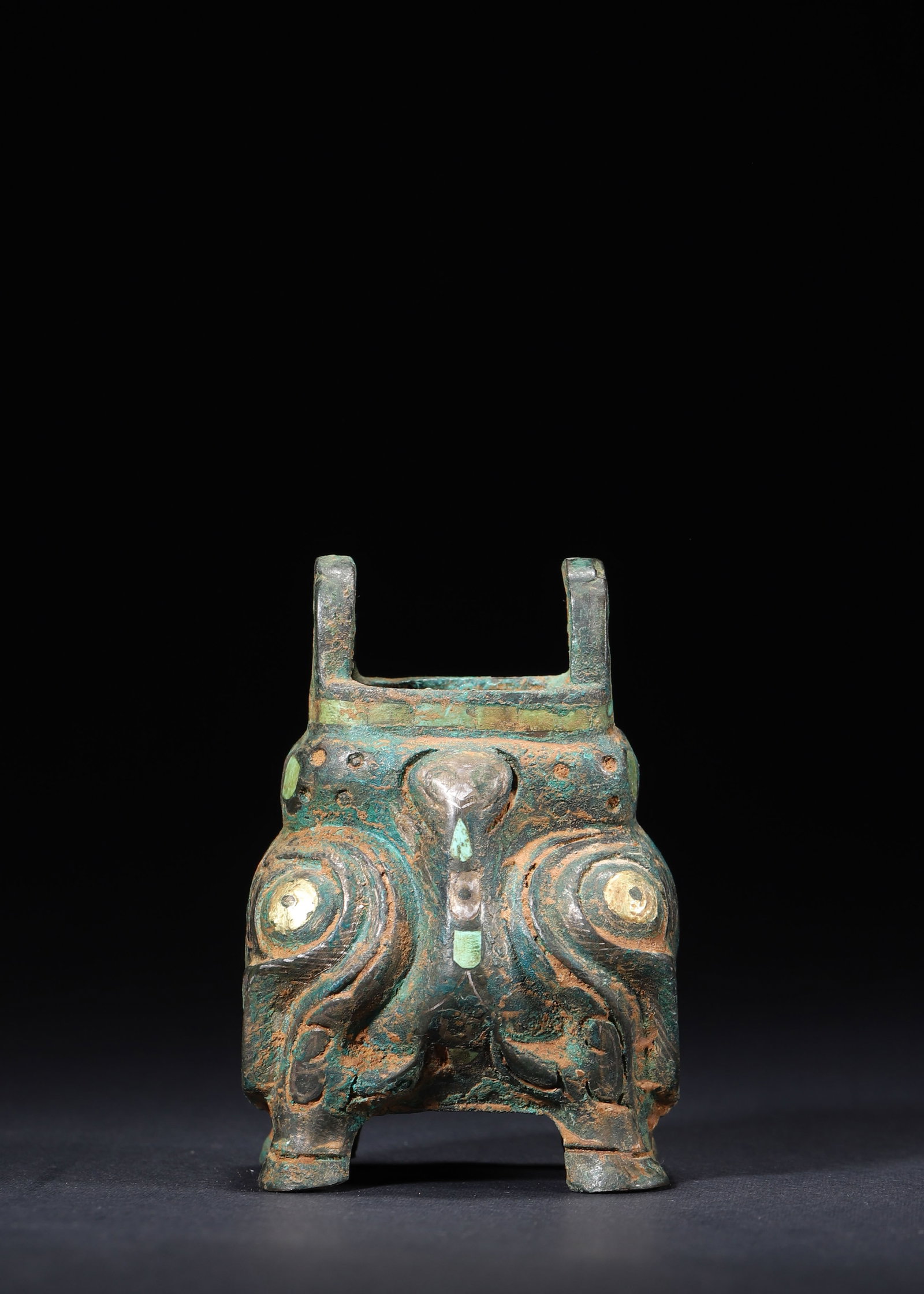 A Han Dynasty Gilt-Silver and Turquoise-Inlaid Bronze Miniature Ding Censer with Taotie Mask Design (1 of 7)