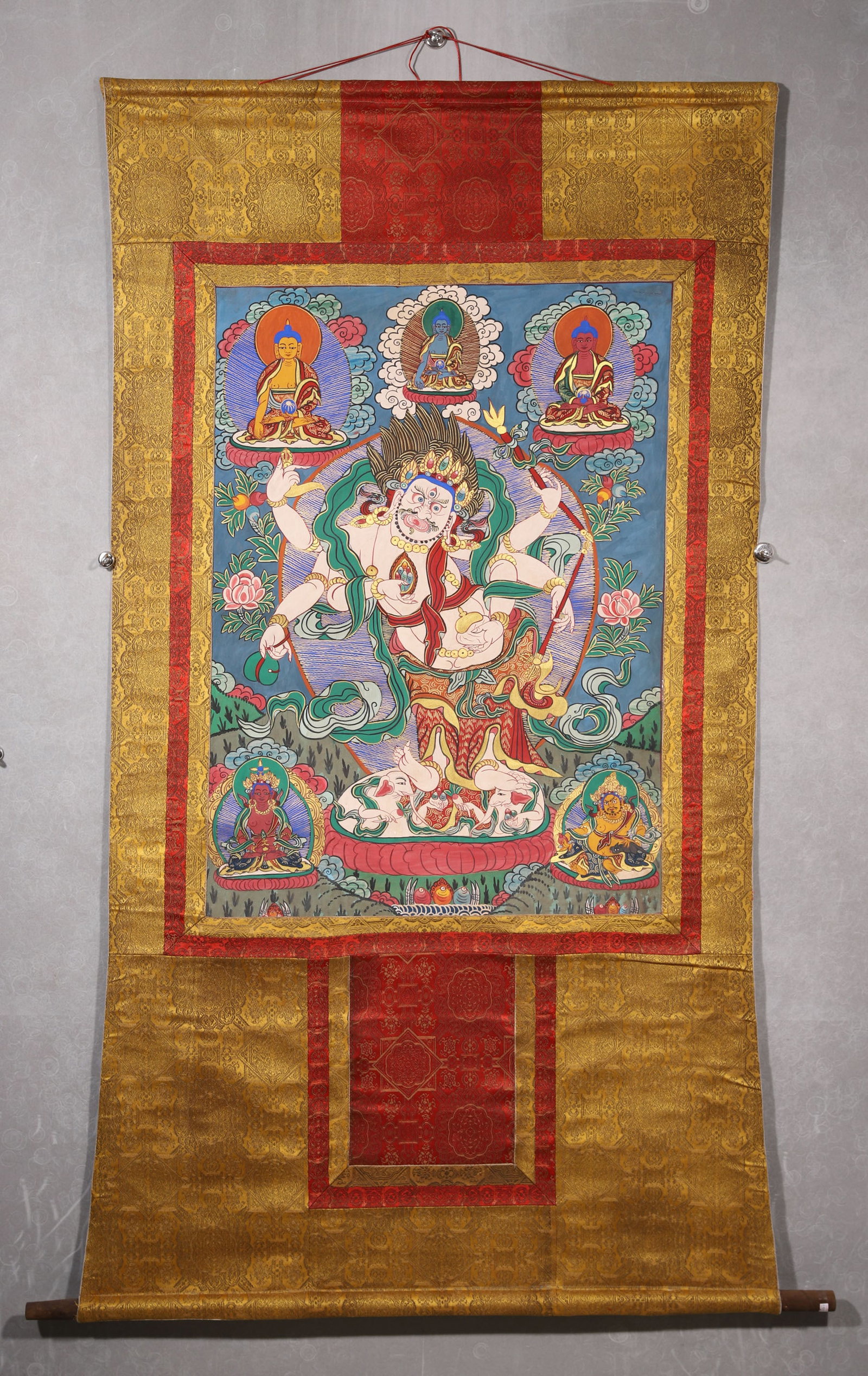 A White Six-Armed Mahakala Thangka - Qing Dynasty: Length 94.0cm (37.01in), Width 68.0cm (26.77in)This Qing Dynasty thangka depicts White Six-Armed Mahakala, painted with mineral pigments on cotton. The central protector stands wrathfully with three e