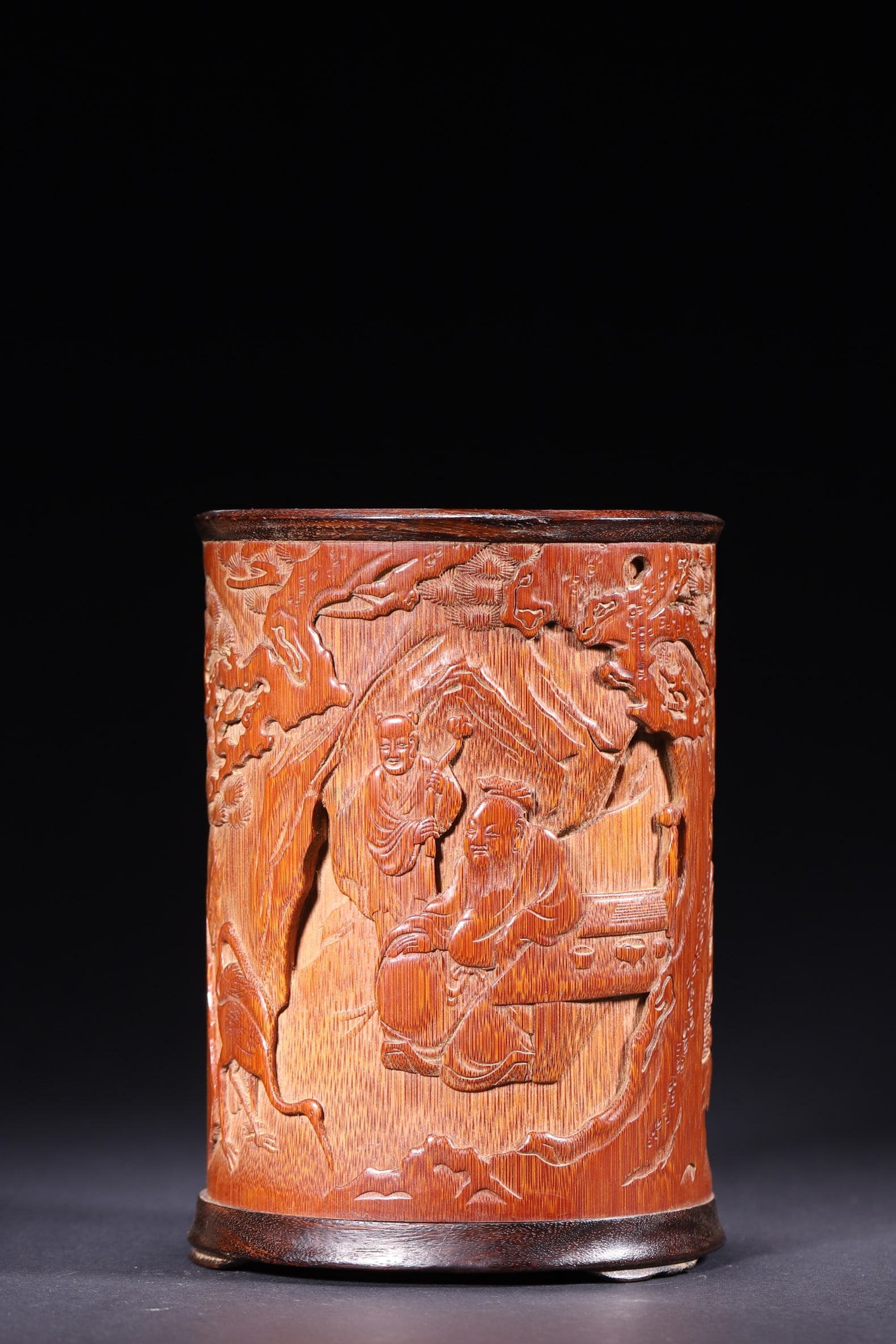 A Qing Dynasty Bamboo Brush Pot with "Scholar Under Pine" Scene, Signed Wu Tingkang: Diameter 10.5cm (4.13in), Height 15.0cm (5.91in), Weight 372.0g (0.82lb)This is a Qing Dynasty bamboo brush pot carved with the "Scholar Under Pine" scene, signed "Wu Tingkang". With fine relief carvi