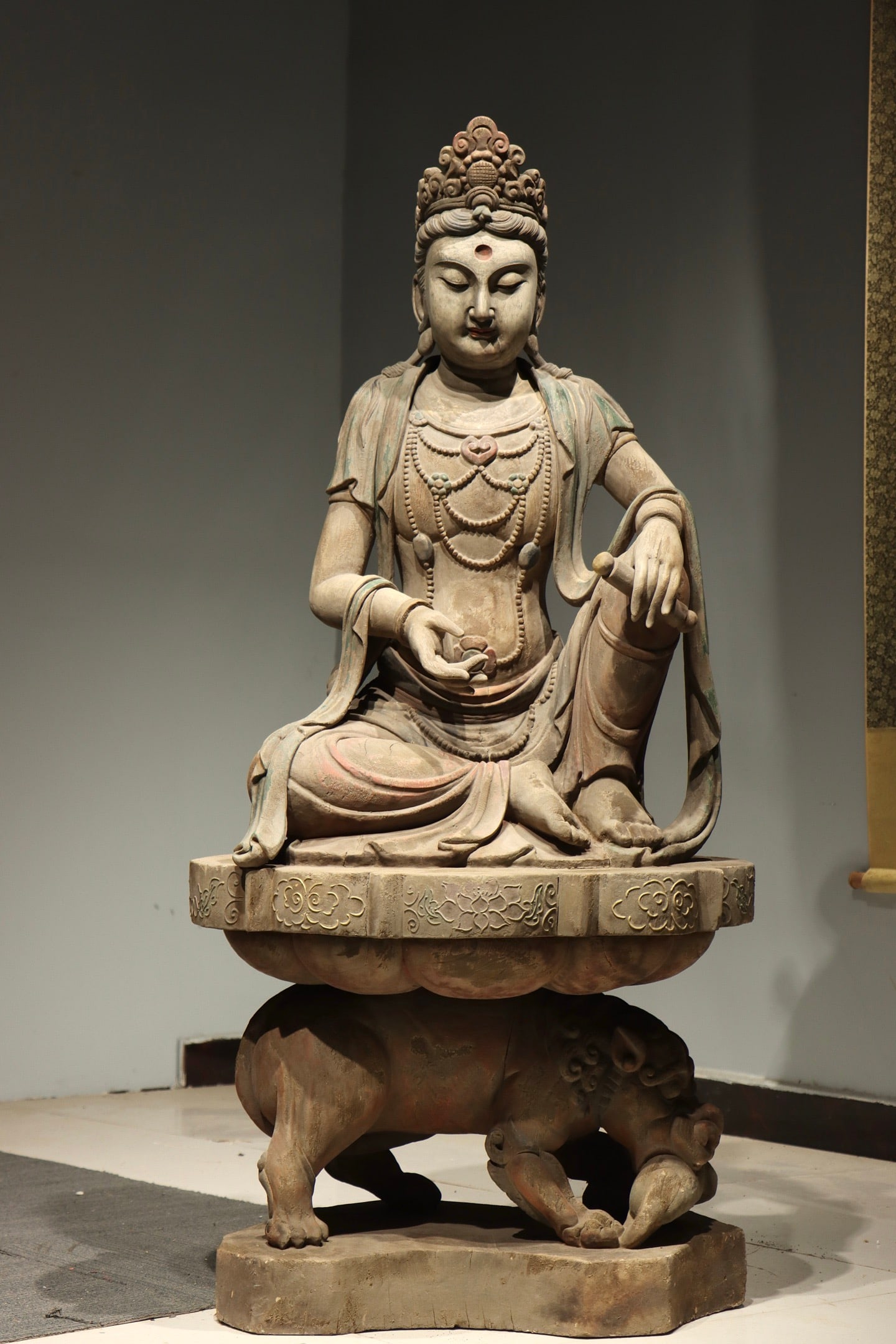 A Polychrome Wood Figure of Guanyin Holding Scroll Seated on a Lion - Ming Dynasty (1 of 9)