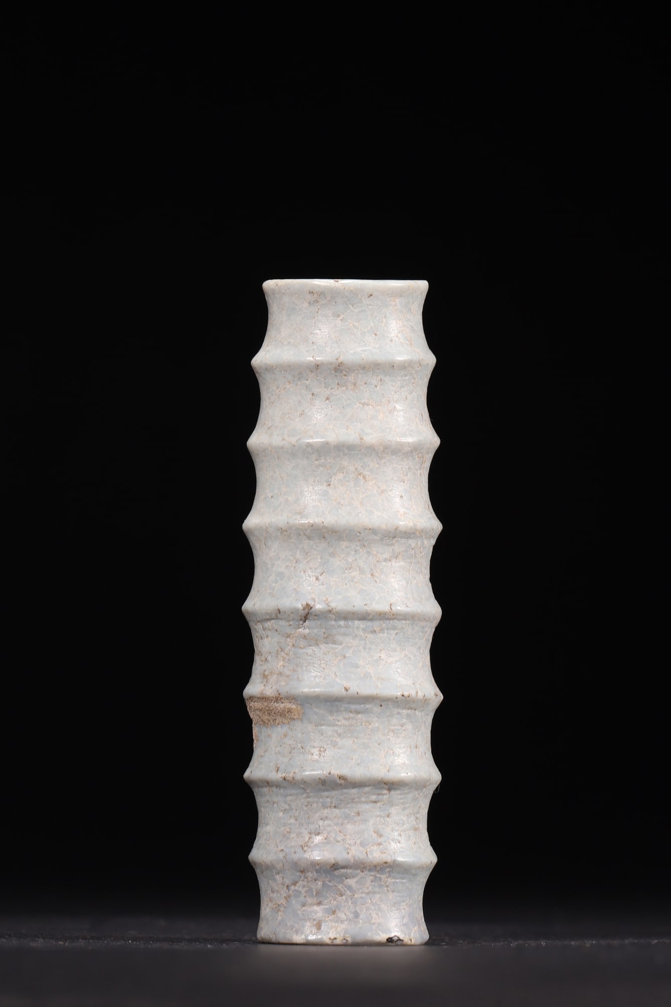 A Chicken Bone White Jade Bamboo Lezi, Han Dynasty: Length 9.3cm (3.66in), Width 2.8cm (1.1in), Weight 95.0g (0.21lb)This Han Dynasty chicken bone white jade lezi is carved into a bamboo shape with natural patina. It features concise lines and auspicio