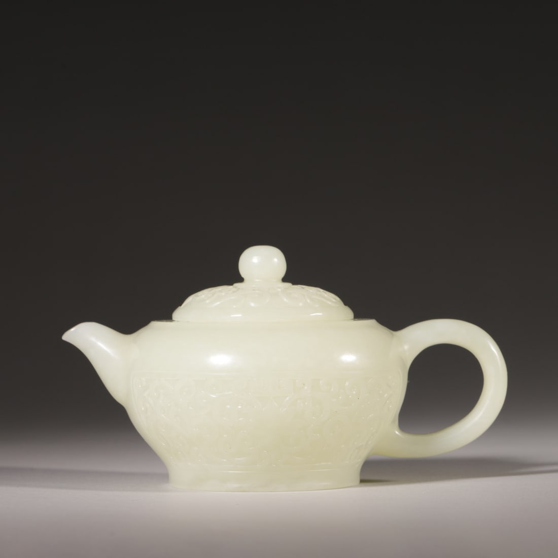 A Hetian White Jade Teapot with Scrolling Lotus Pattern, Qing Dynasty (1 of 5)