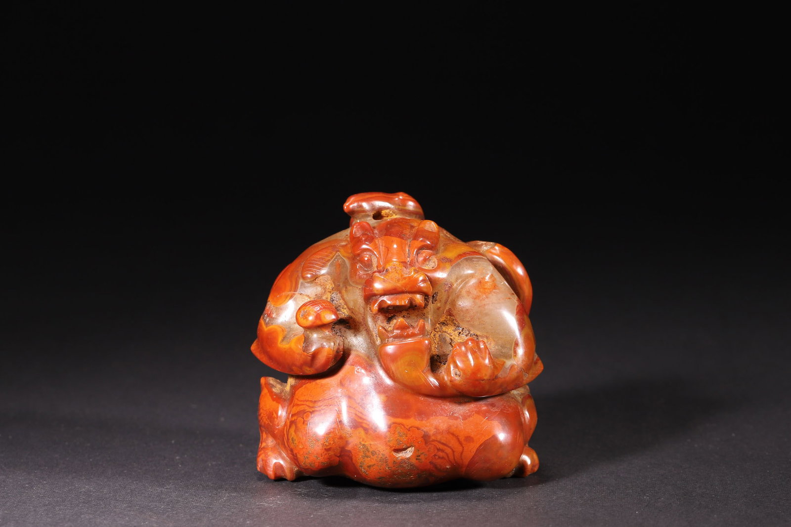 A Han Dynasty Red Agate Auspicious Beast Paperweight (1 of 6)